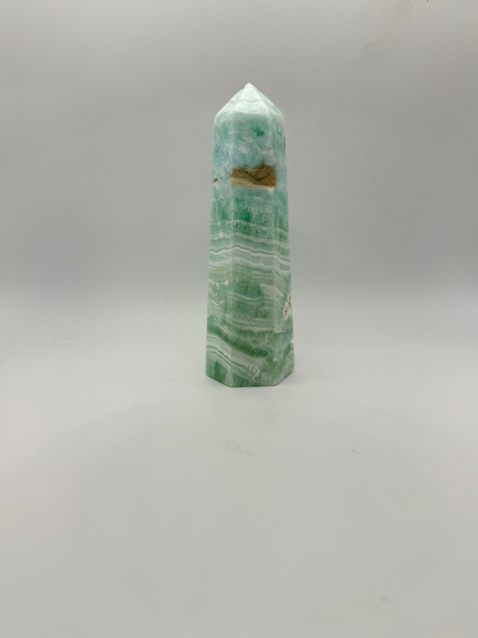 Caribbean Calcite polished six sided tower. This is 5.25 inches tall.