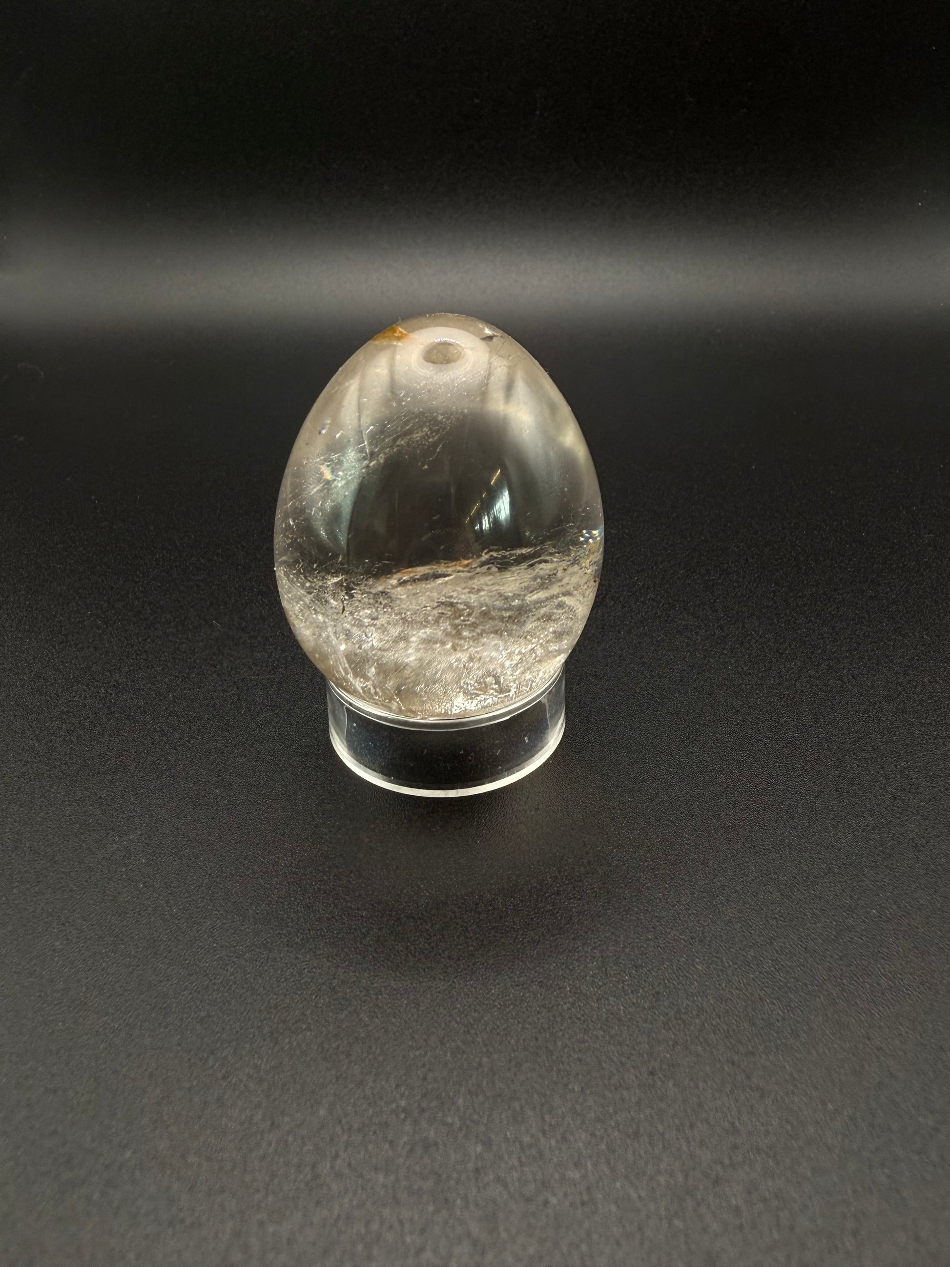 Clear quartz polished crystal thats egg shaped.