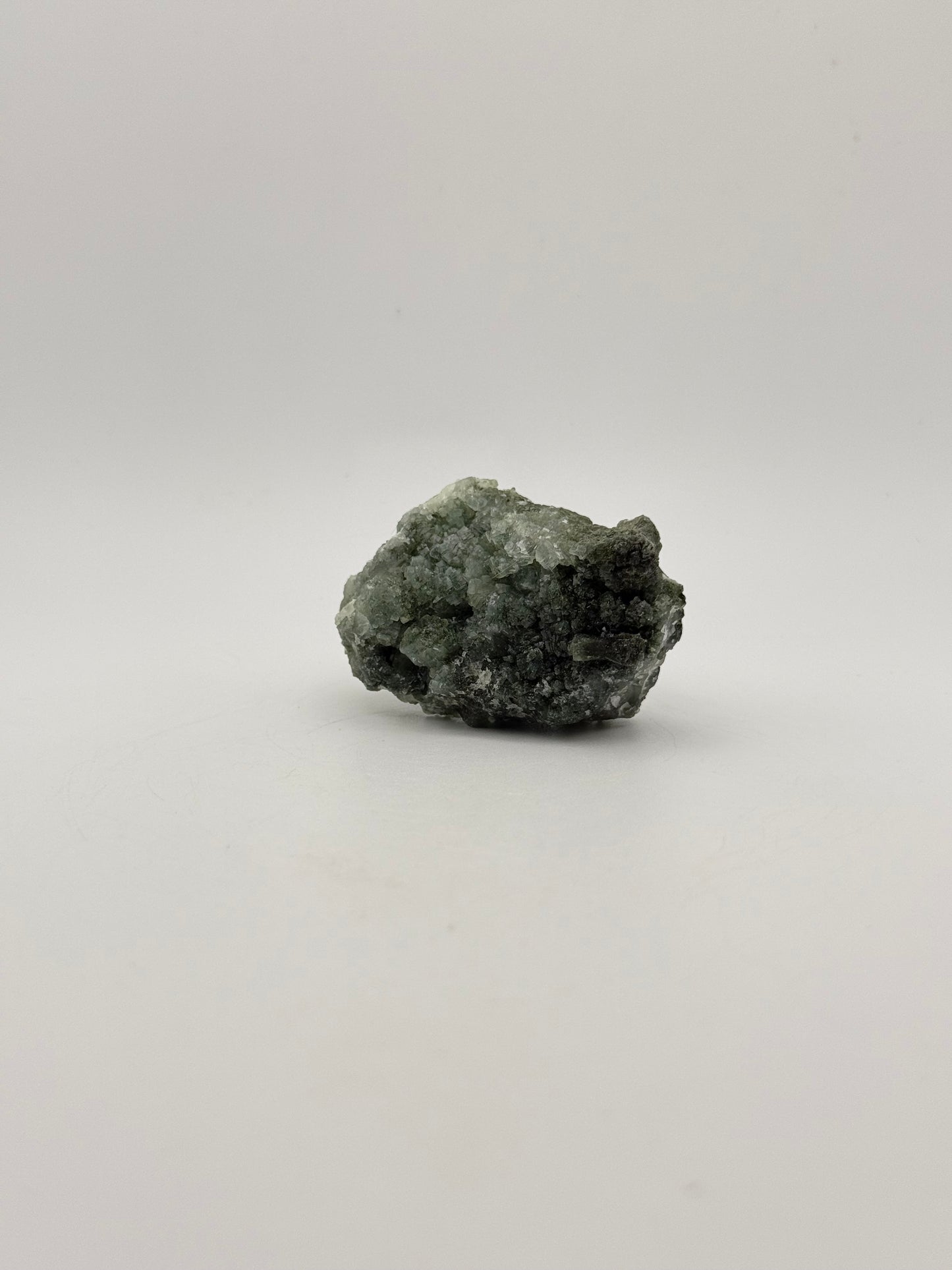 Raw Prehnite specimen with amazing green color.