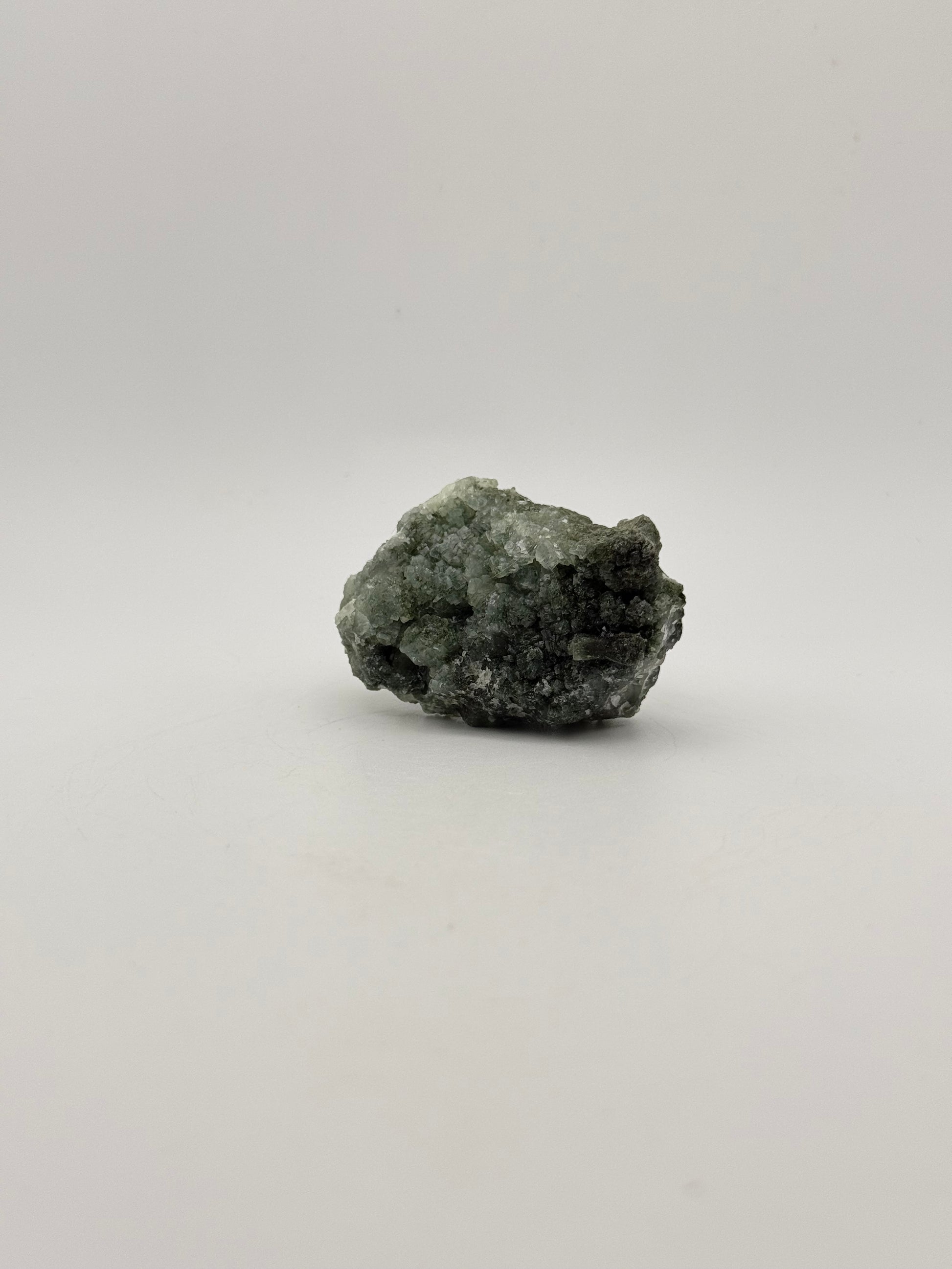 Raw Prehnite specimen with amazing green color.