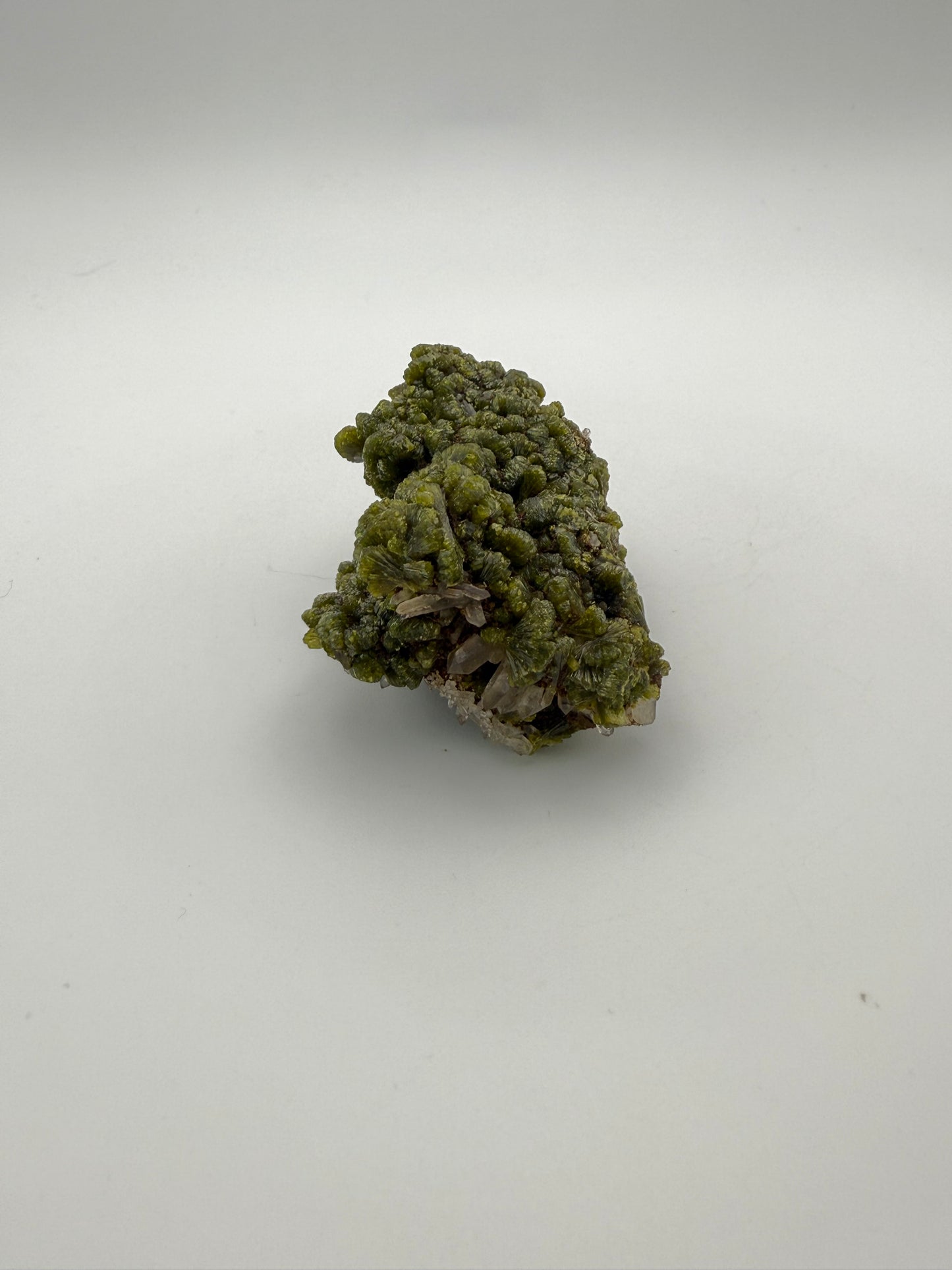 Epidote crystal cluster with good green color.