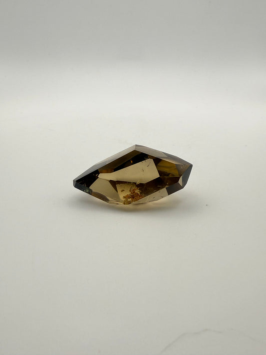 Polished natural citrine point.