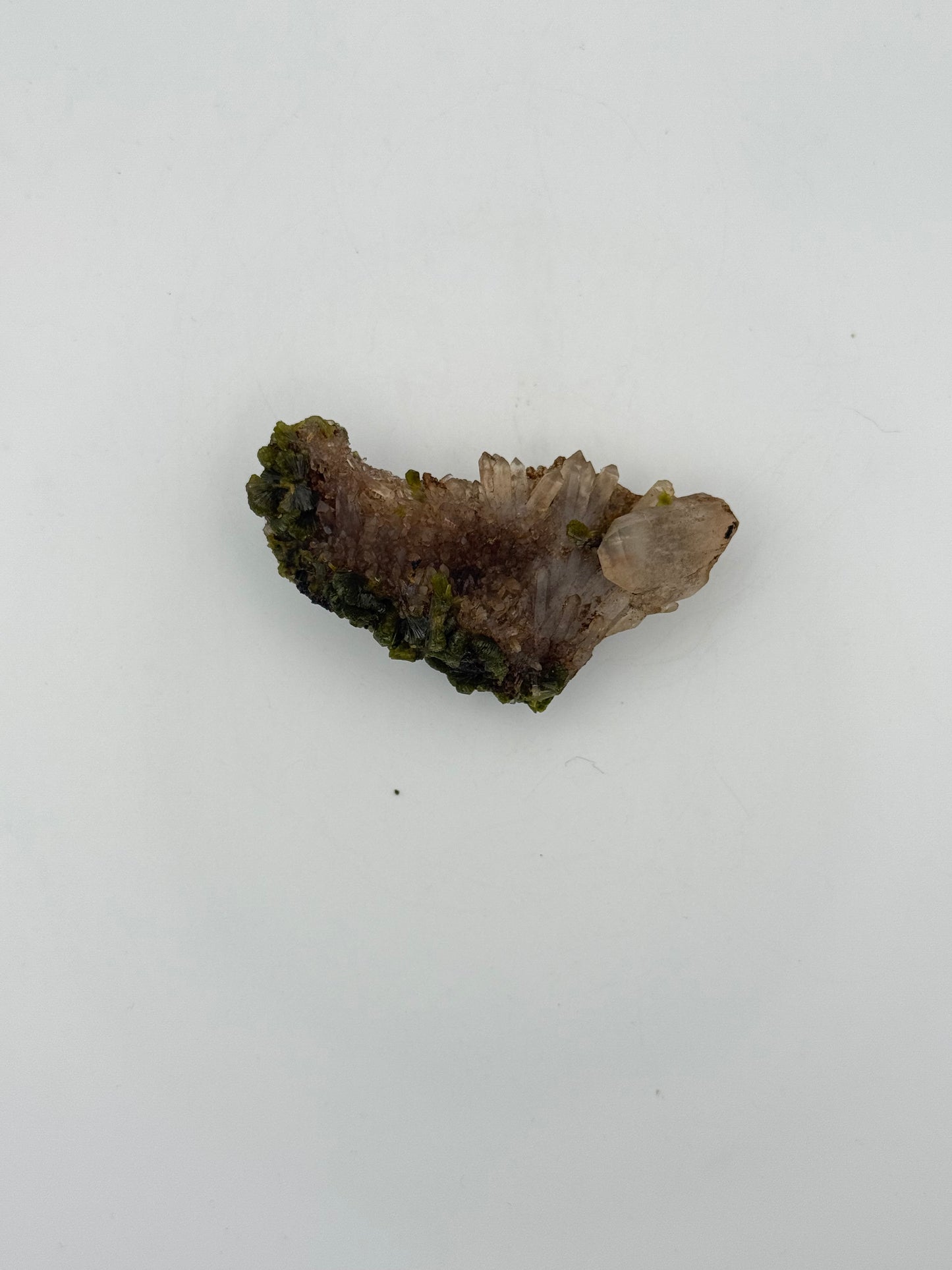 Epidote crystal cluster with good green color.