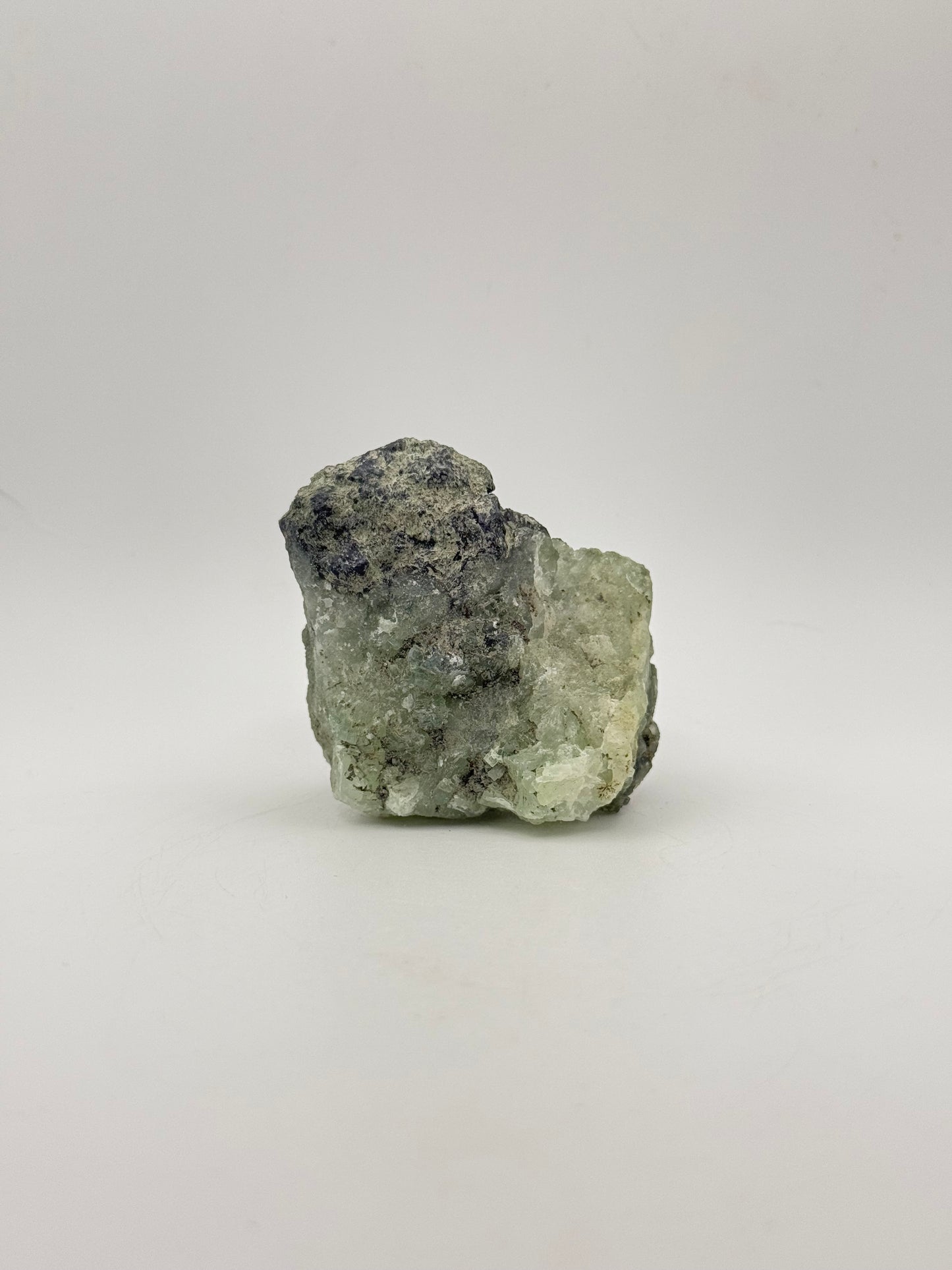 Raw Prehnite specimen with amazing green color.