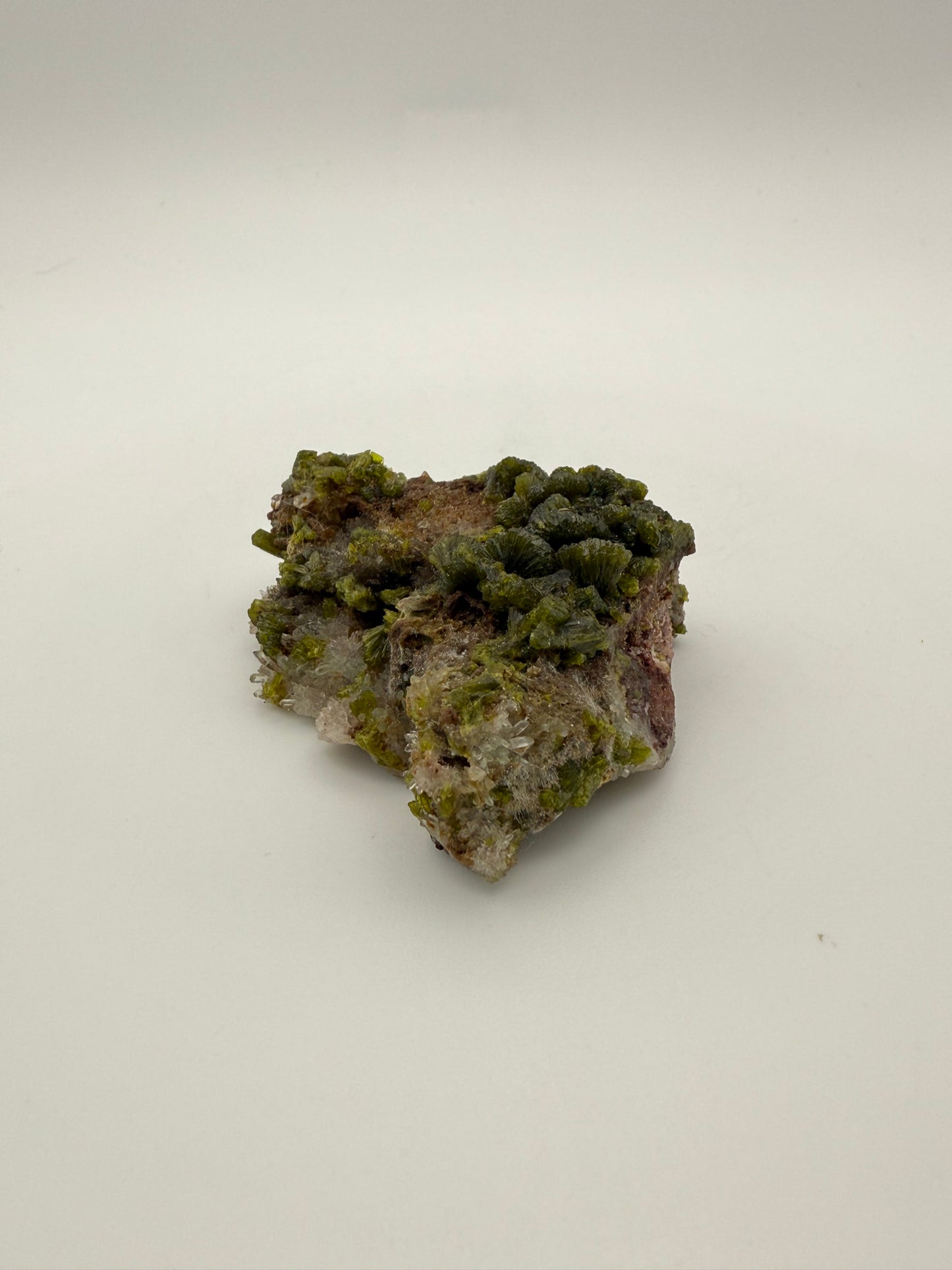 Epidote crystal cluster with good green color.