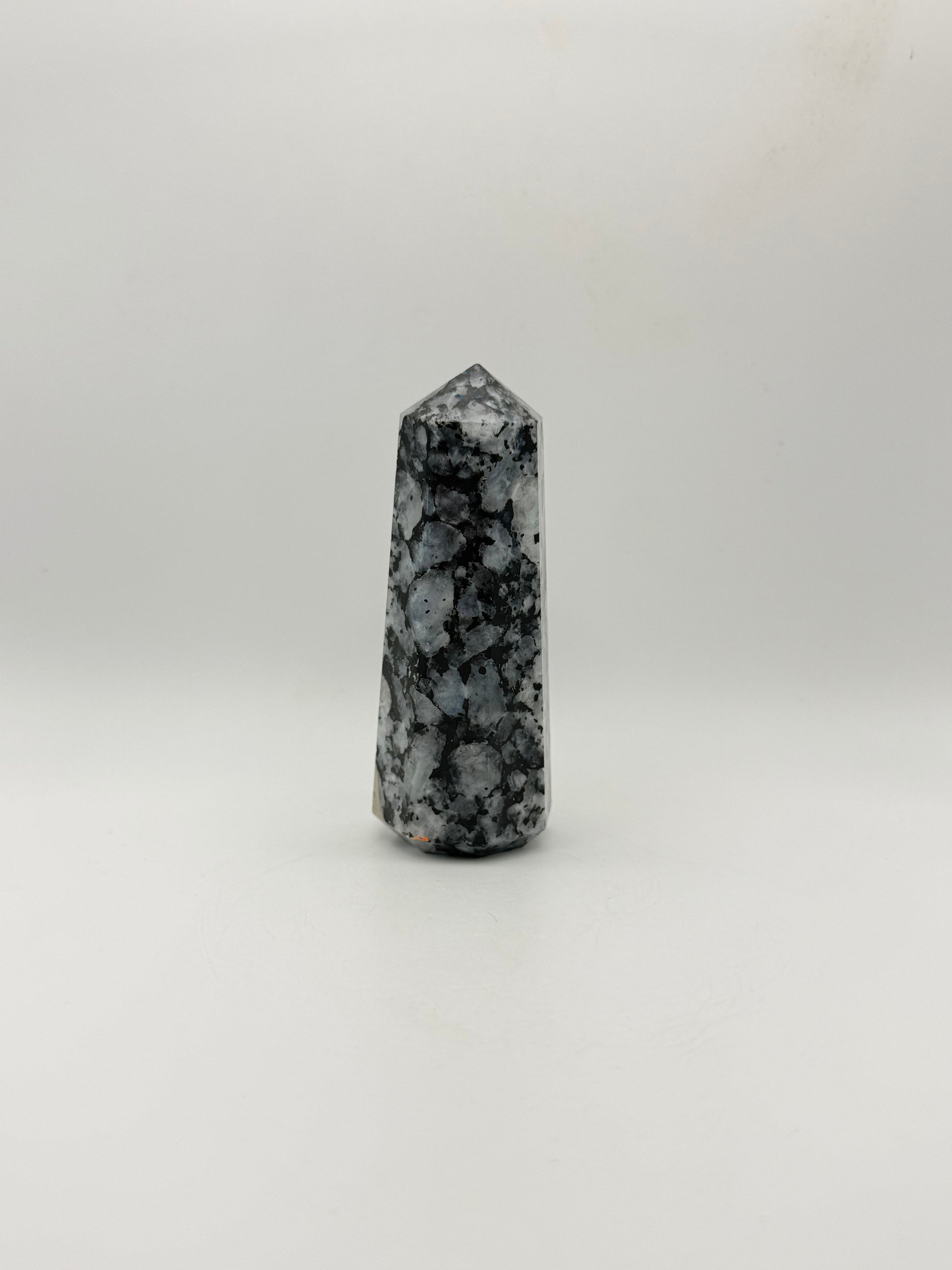 Polished rainbow moonstone tower with nice flashes of blue.