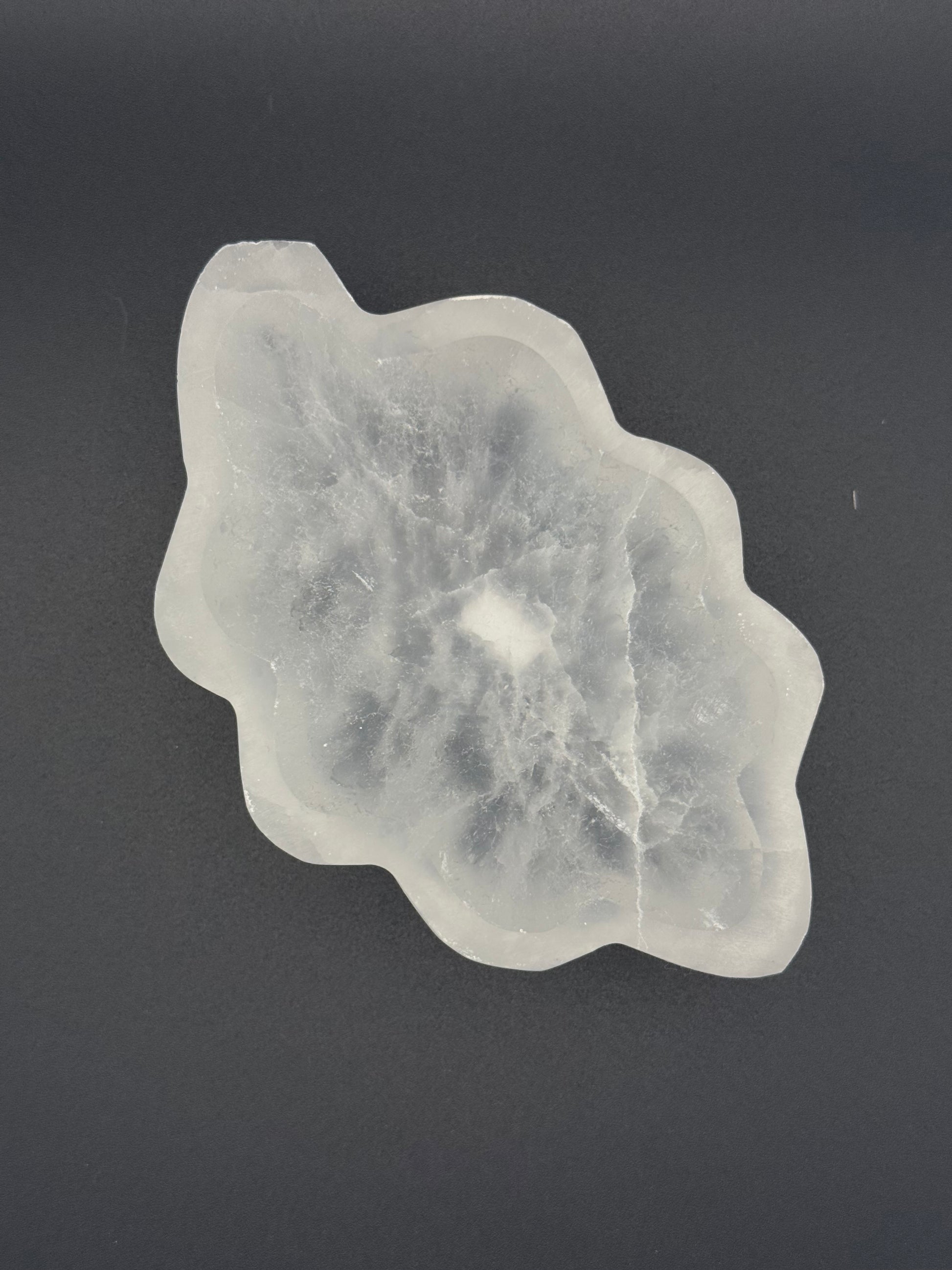 Selenite bowl in the shape of a leaf.