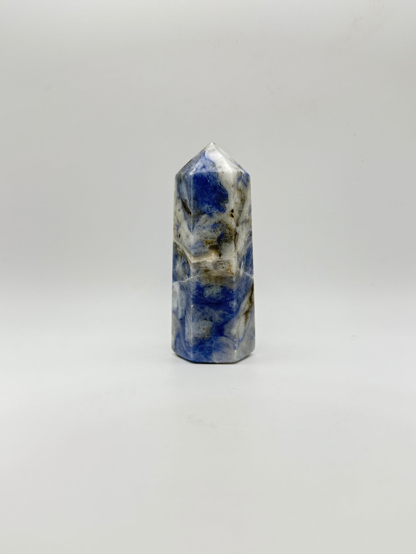 Afghanite six sided tower. Height of 3 3/4 inches, width of 1 1/2 inches.
