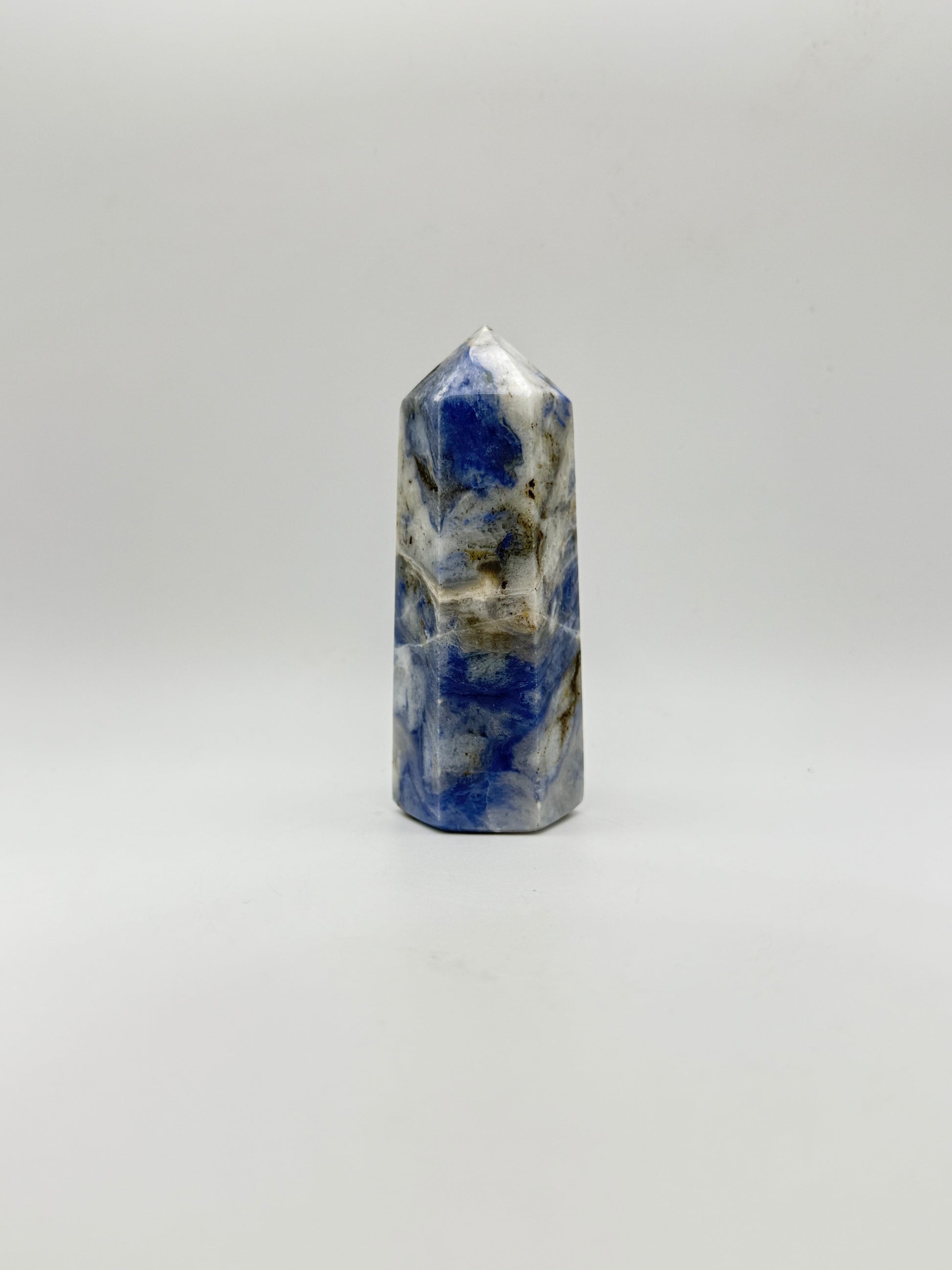 Afghanite six sided tower. Height of 3 3/4 inches, width of 1 1/2 inches.