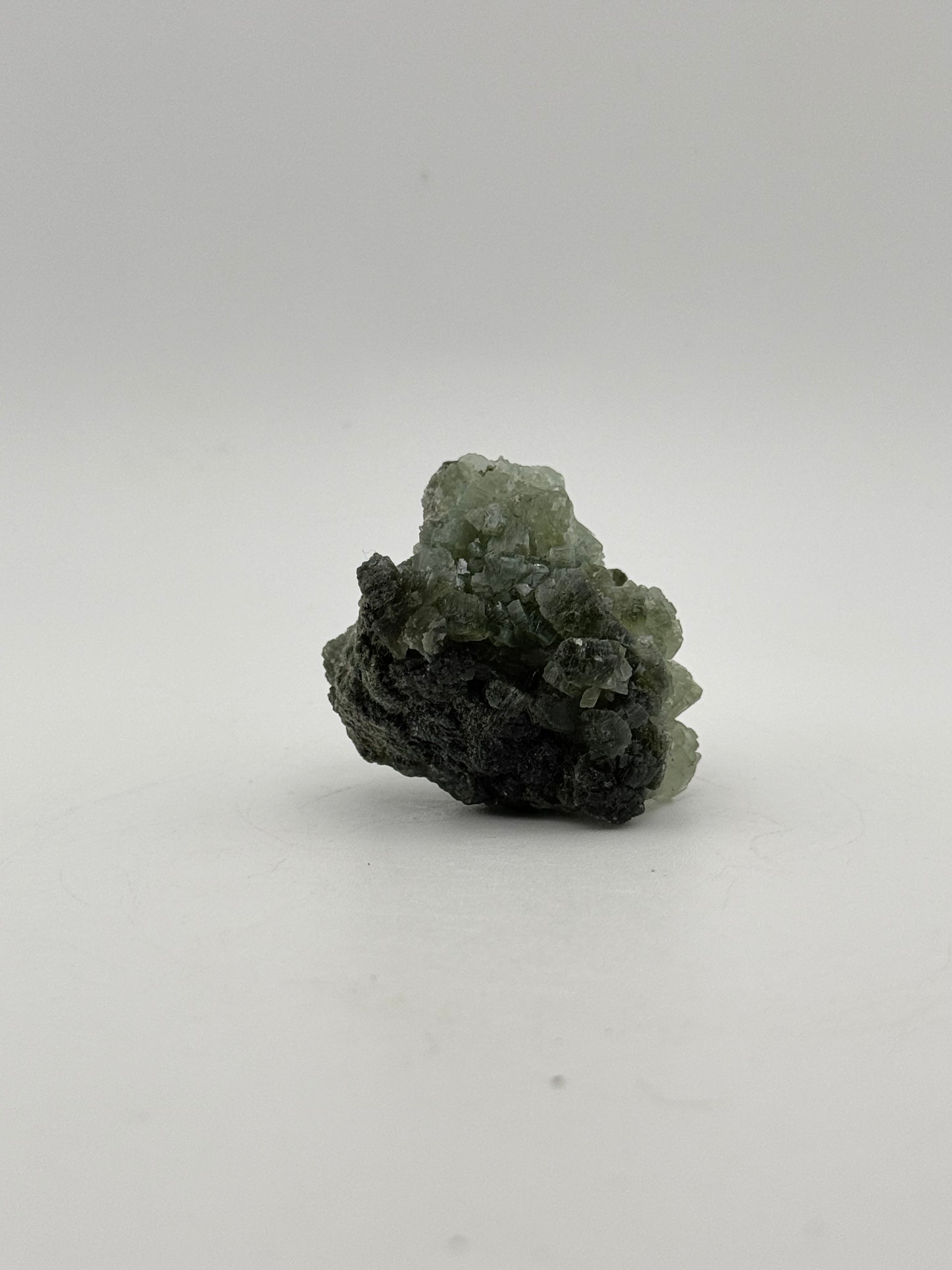 Raw Prehnite specimen with amazing green color.