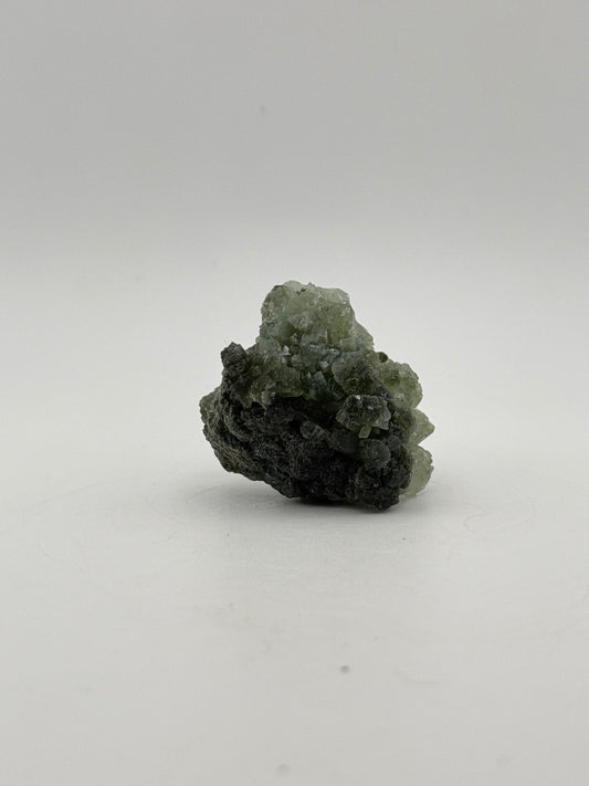 Raw Prehnite specimen with amazing green color.