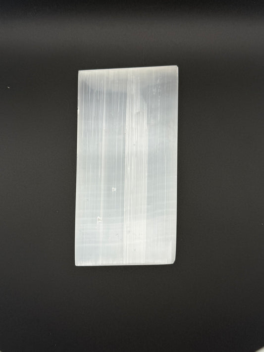 Selenite plate in the shape of a rectangle.