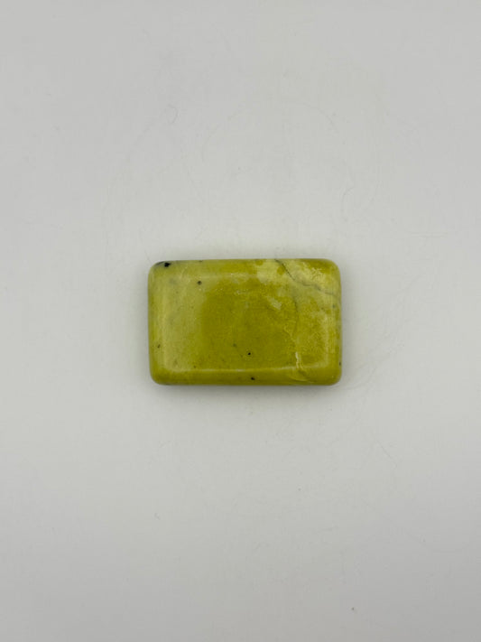 Polished healerite in the shape of a rectangular soap.