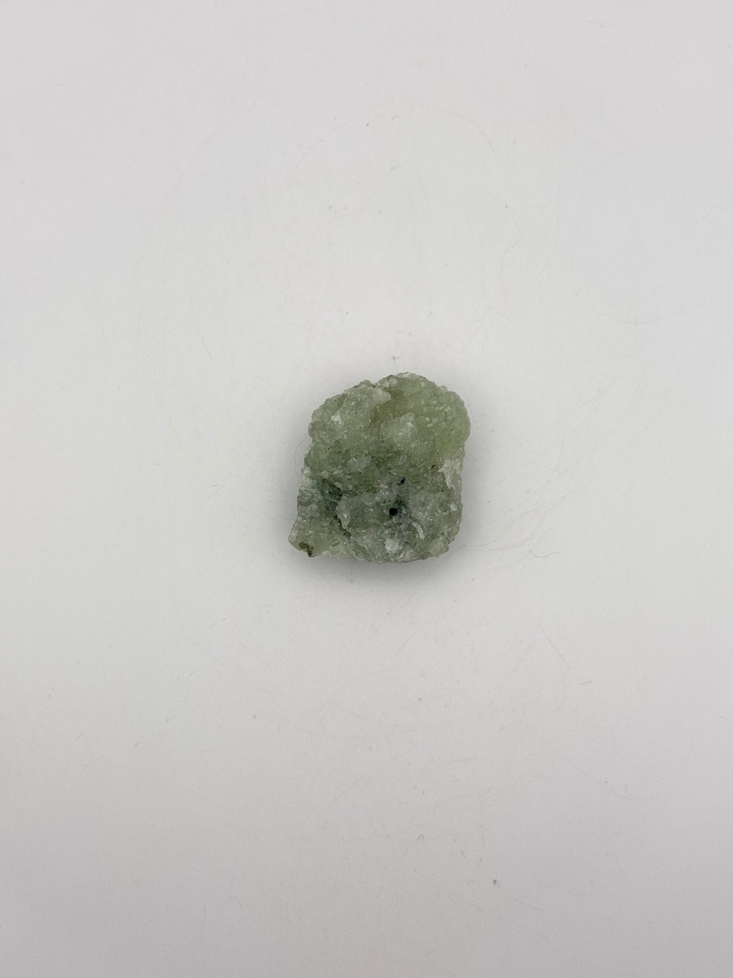 Raw prehnite specimen with amazing green color.