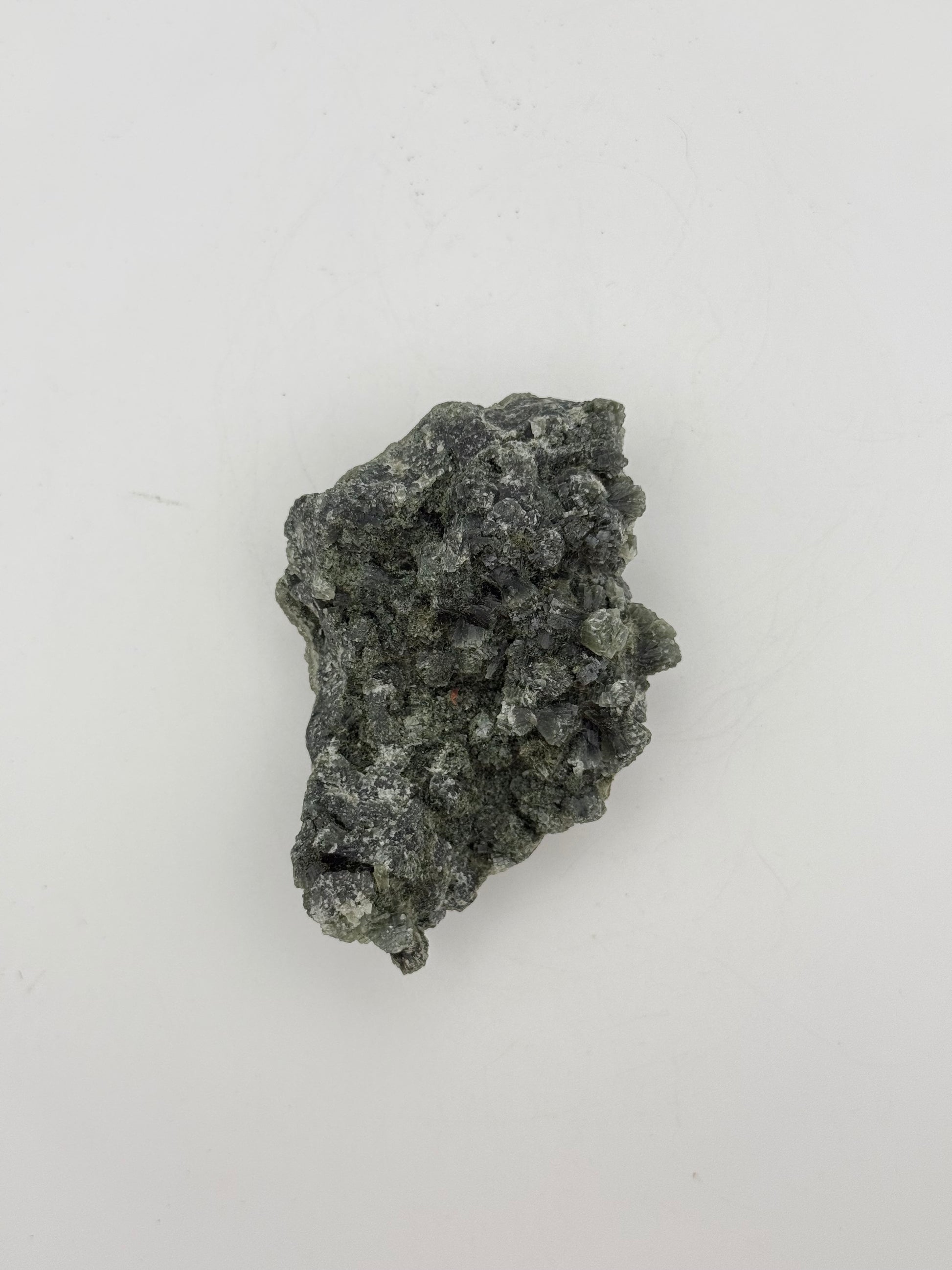 Raw prehnite specimen with amazing green color.