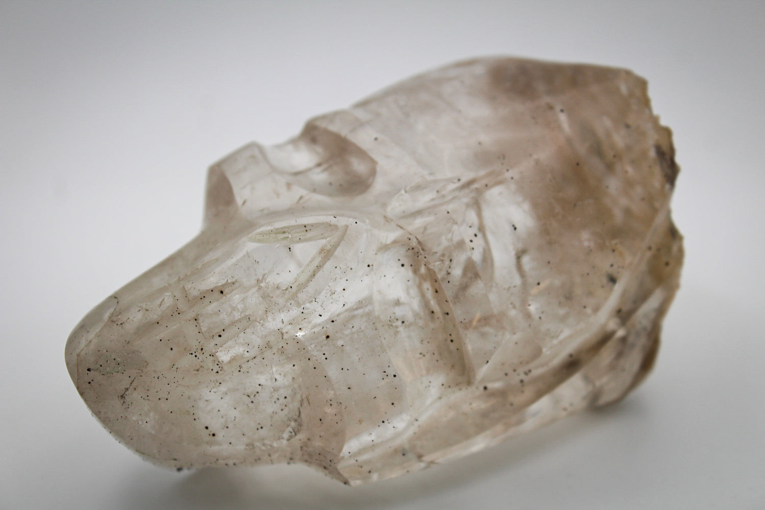 A clear quartz skull sculpture.