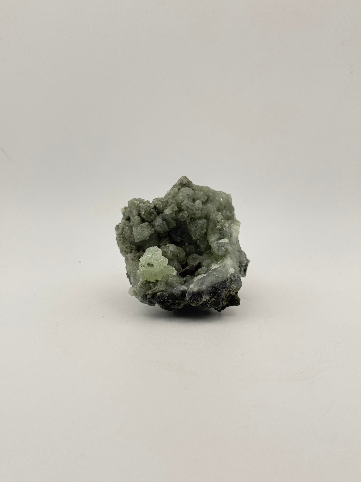 Raw Prehnite specimen with amazing green color.