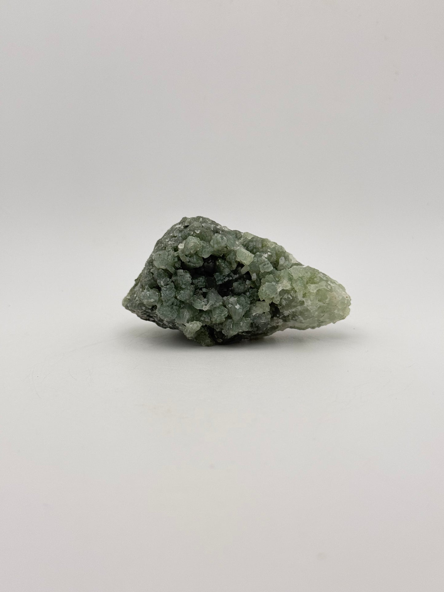 Raw Prehnite specimen with amazing green color.