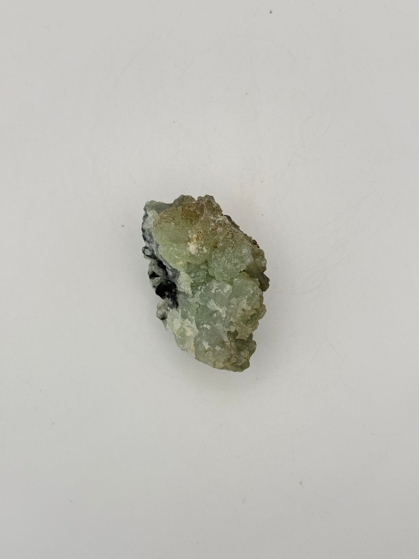 Raw Prehnite specimen with amazing green color.