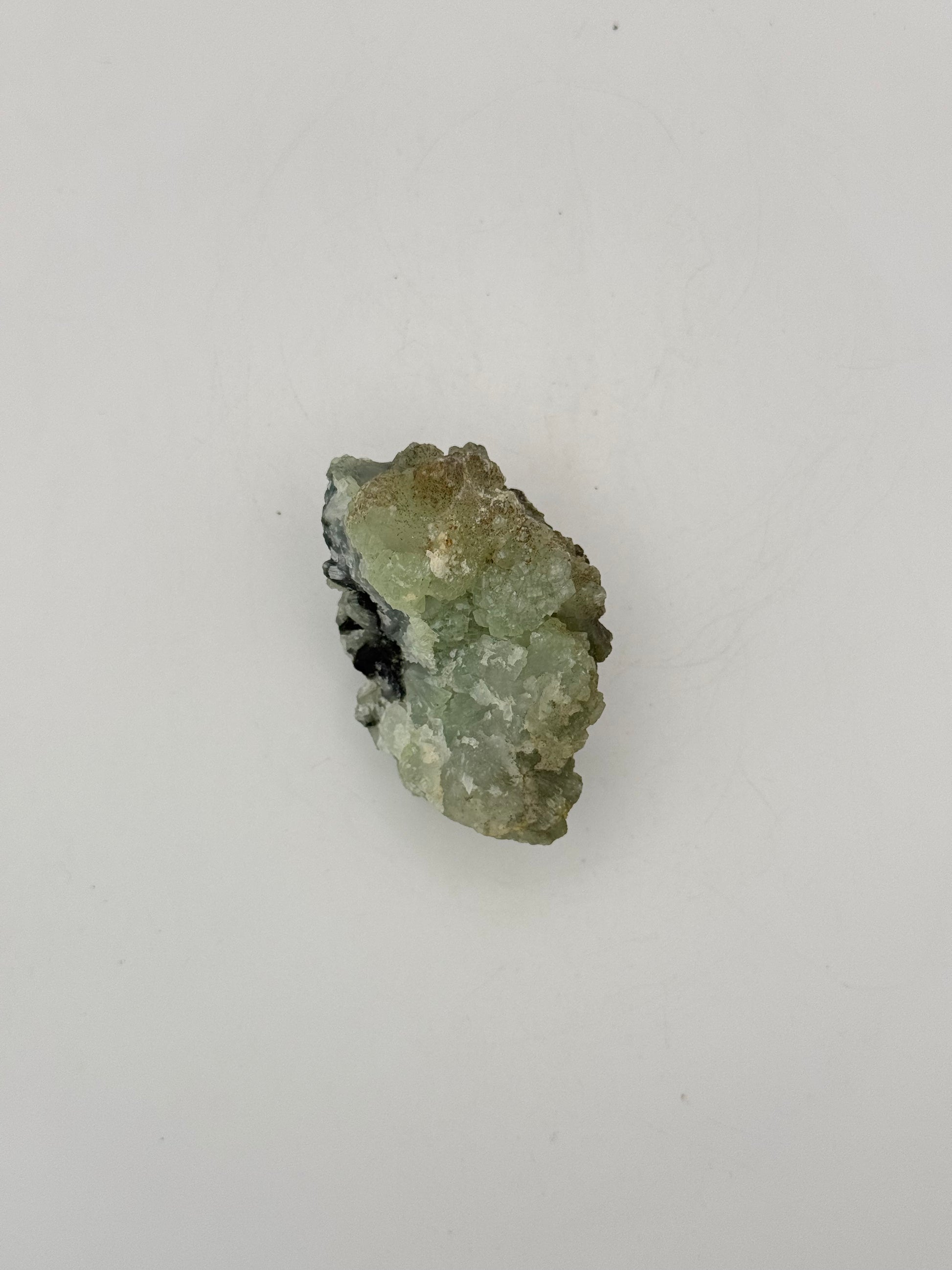 Raw Prehnite specimen with amazing green color.