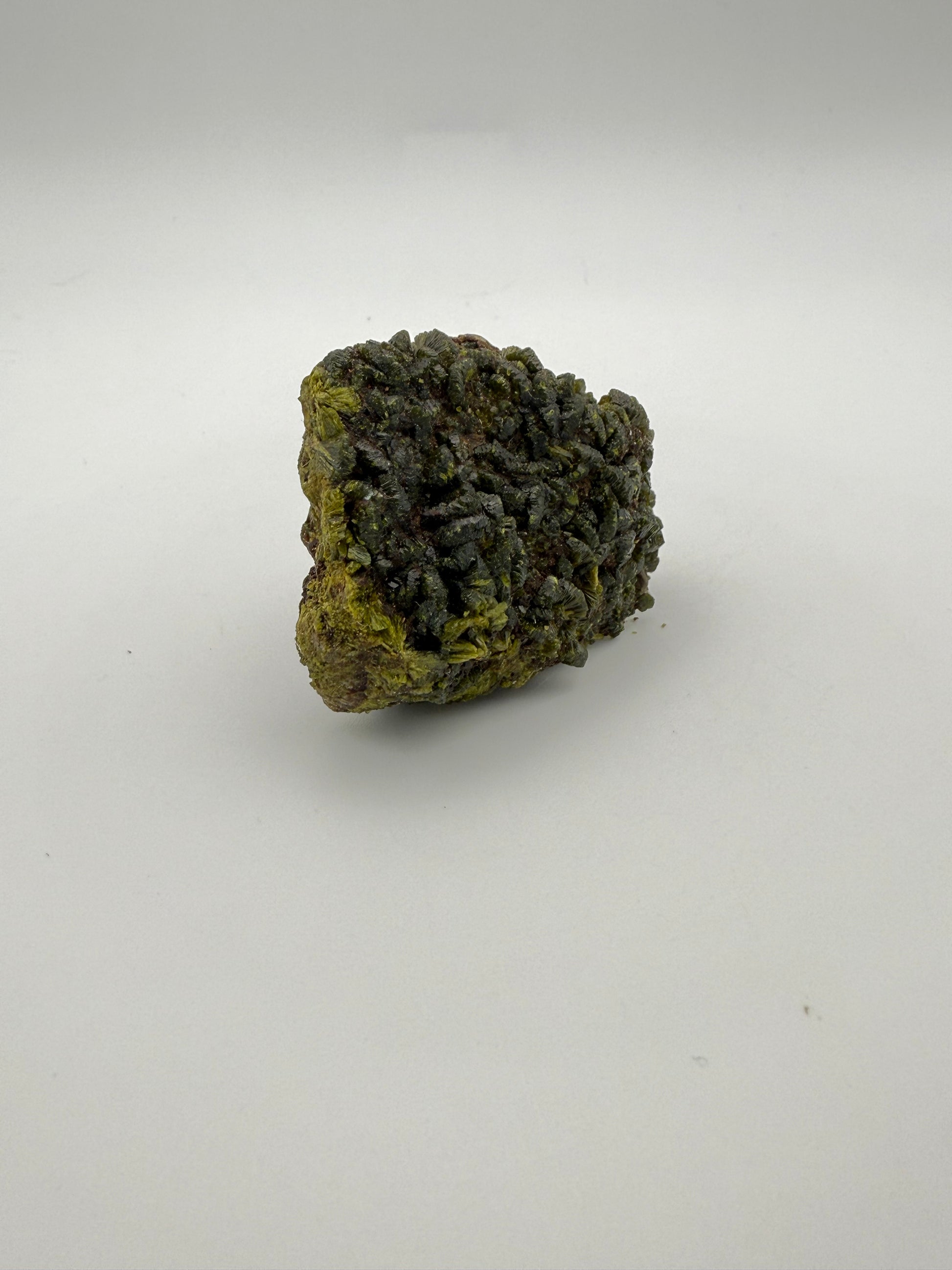 Epidote crystal cluster with good green color.
