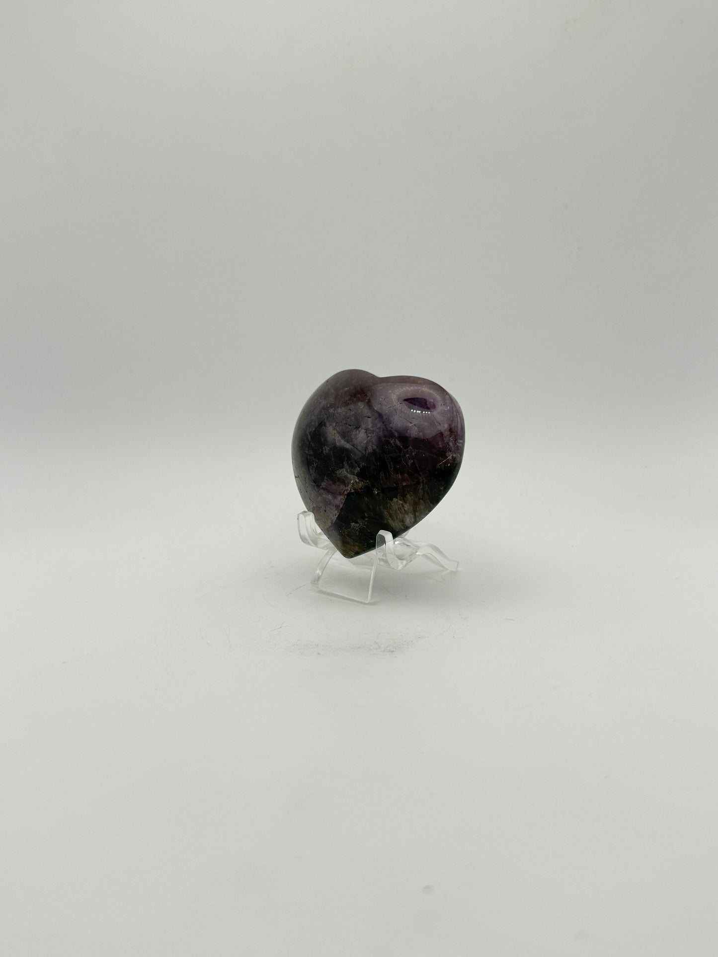 Polished super 7 in the shape of a heart.