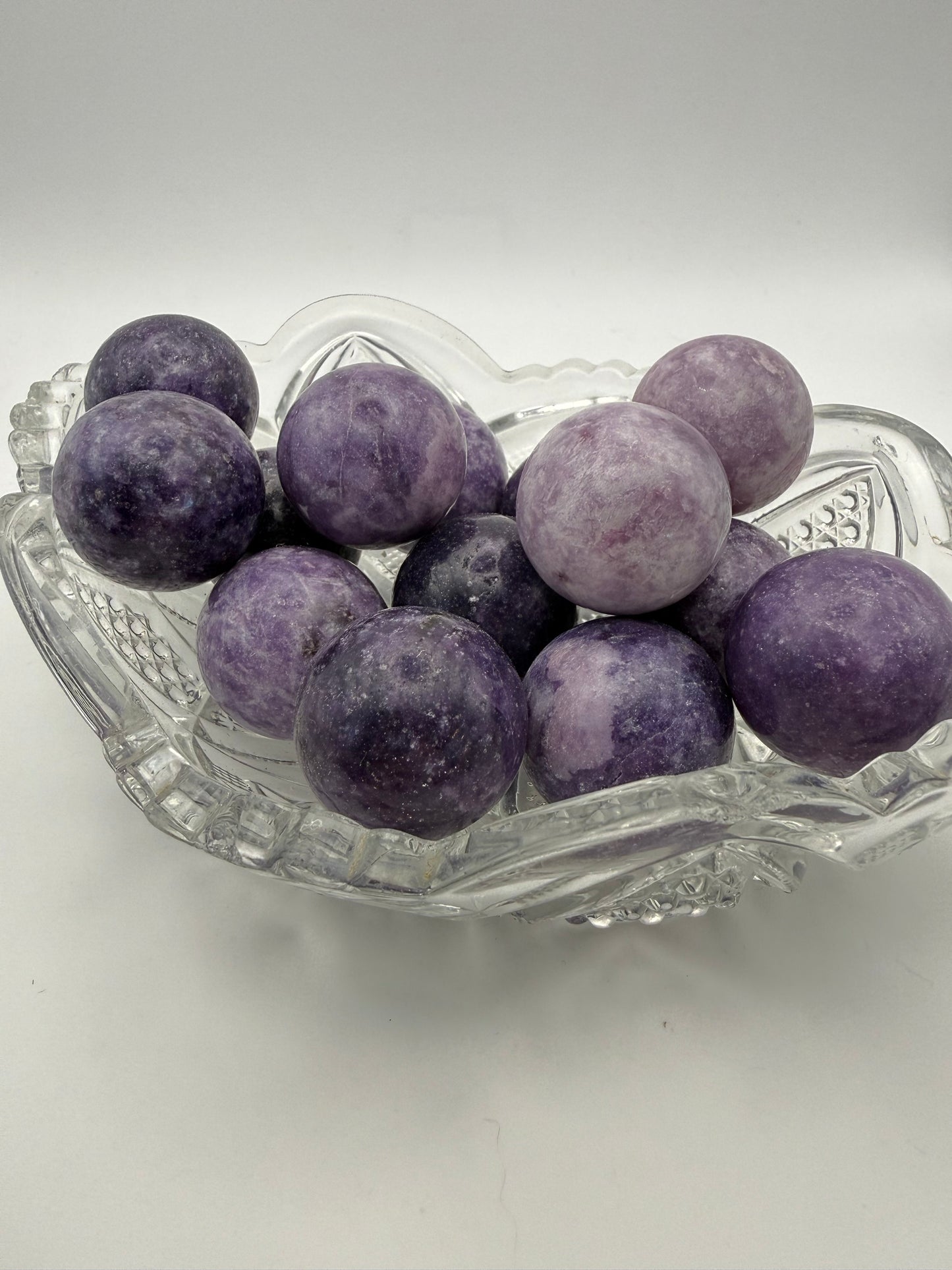Polished Lepidolite spheres about 30mm in size.