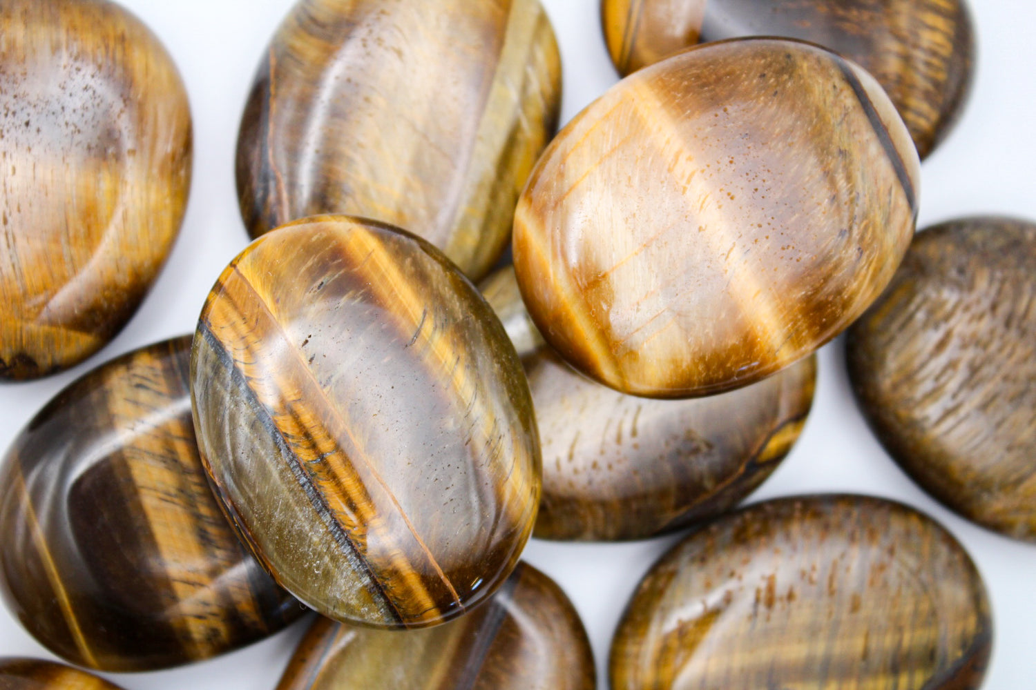 Yellow tiger eye palmstones.