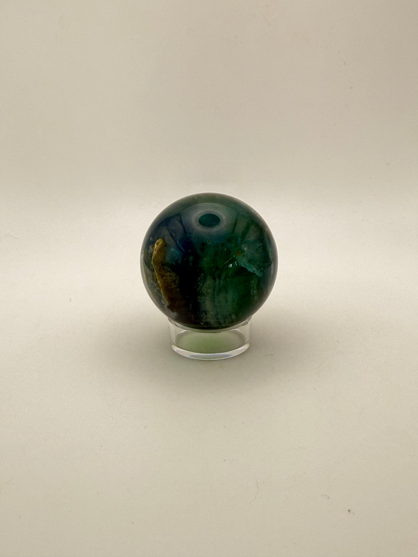 Rainbow Fluorite polished crystal sphere.
