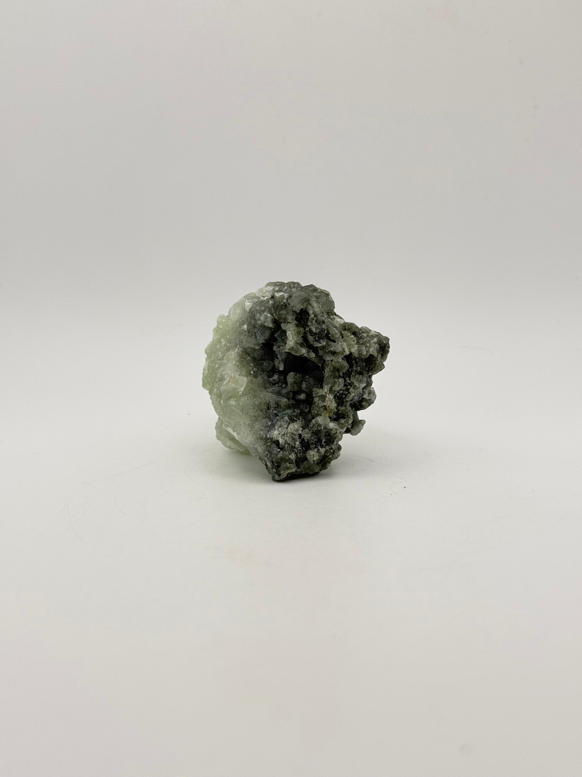 Raw Prehnite specimen with amazing green color.