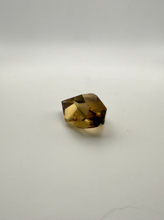 Polished natural citrine point.