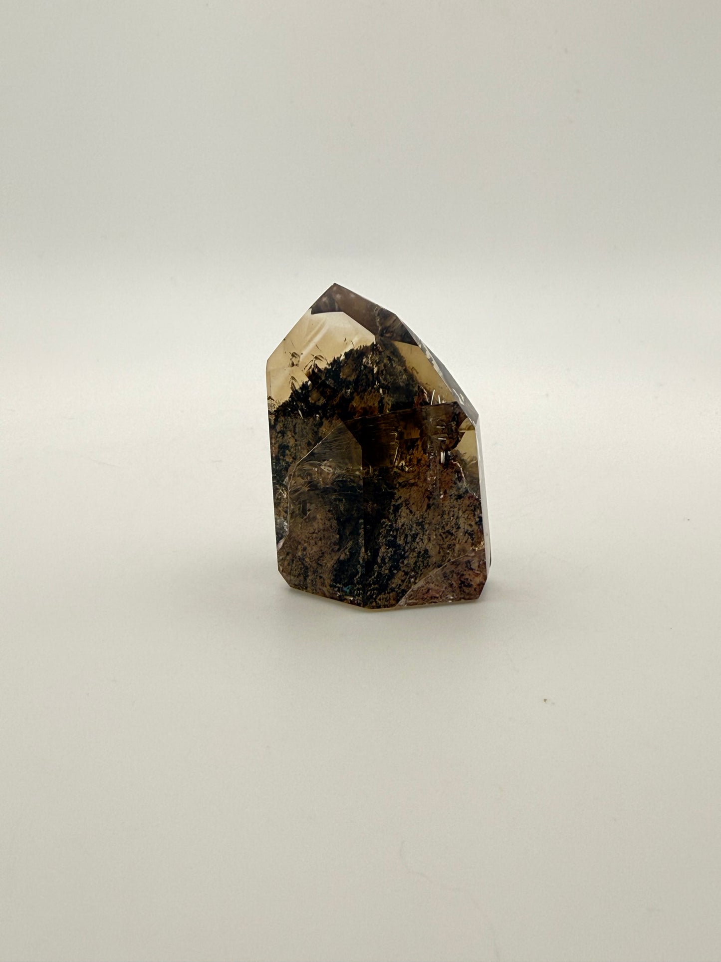 Polished natural citrine point.