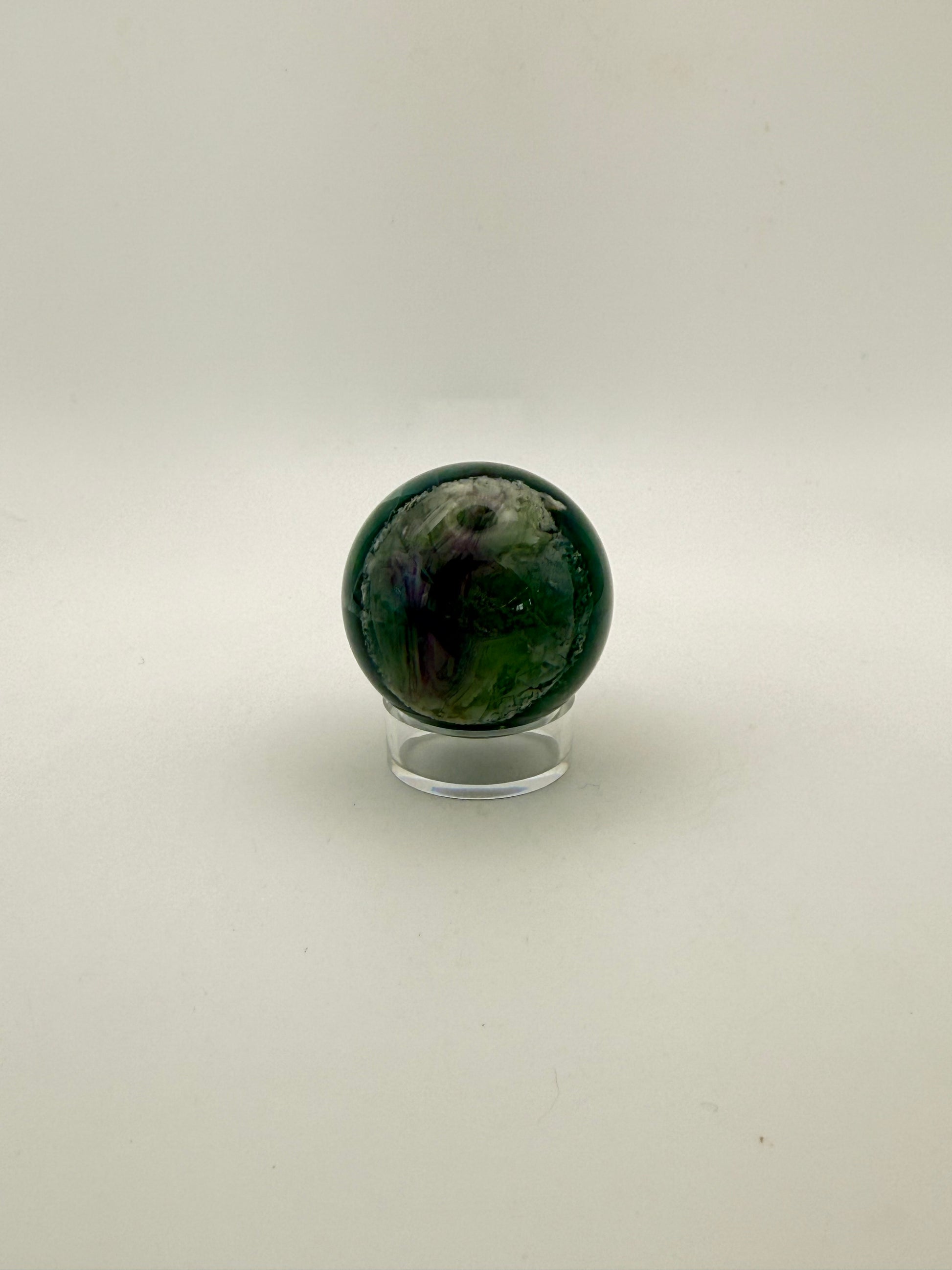 Rainbow Fluorite polished crystal sphere.