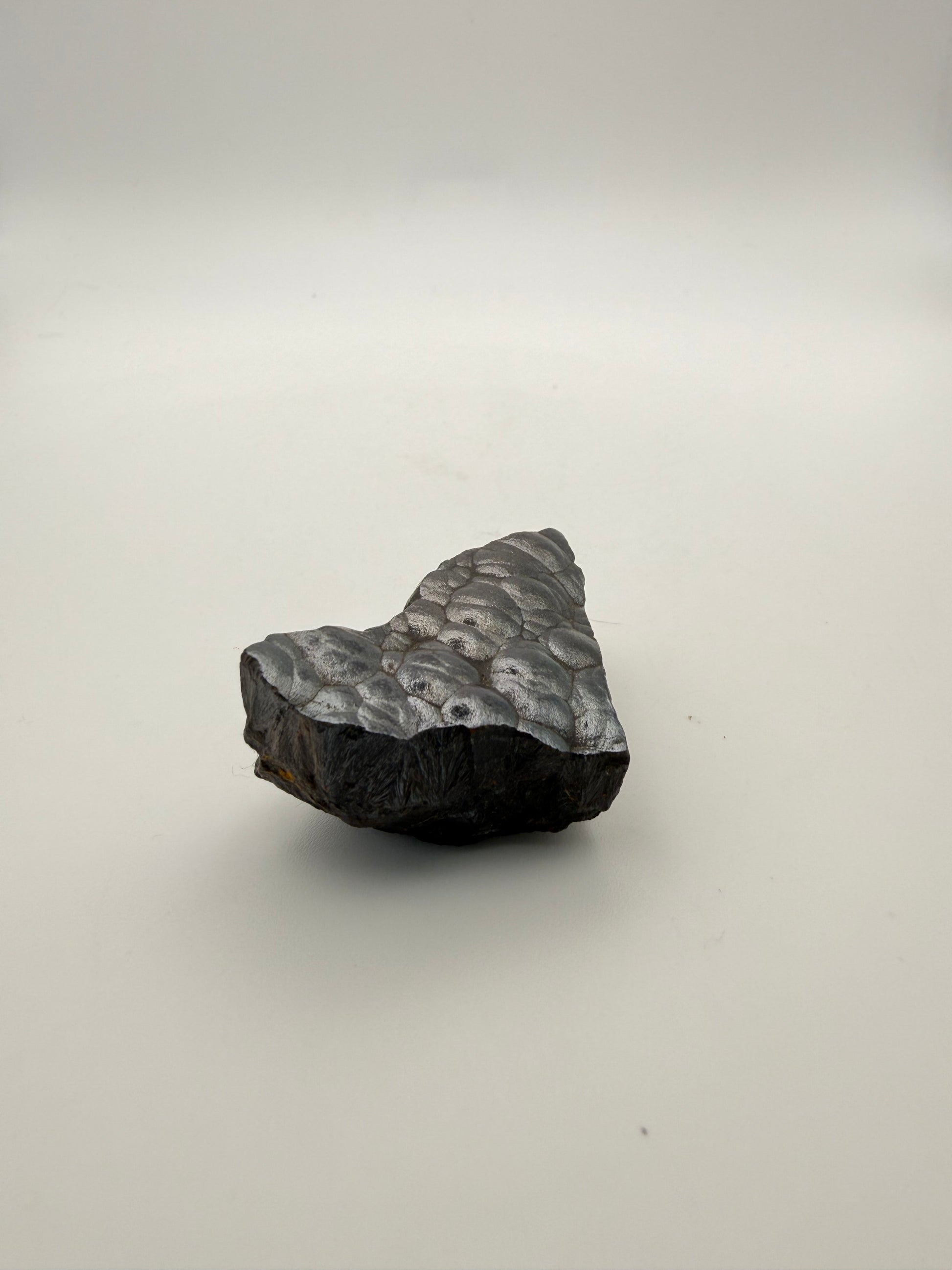 Small raw hematite specimen.