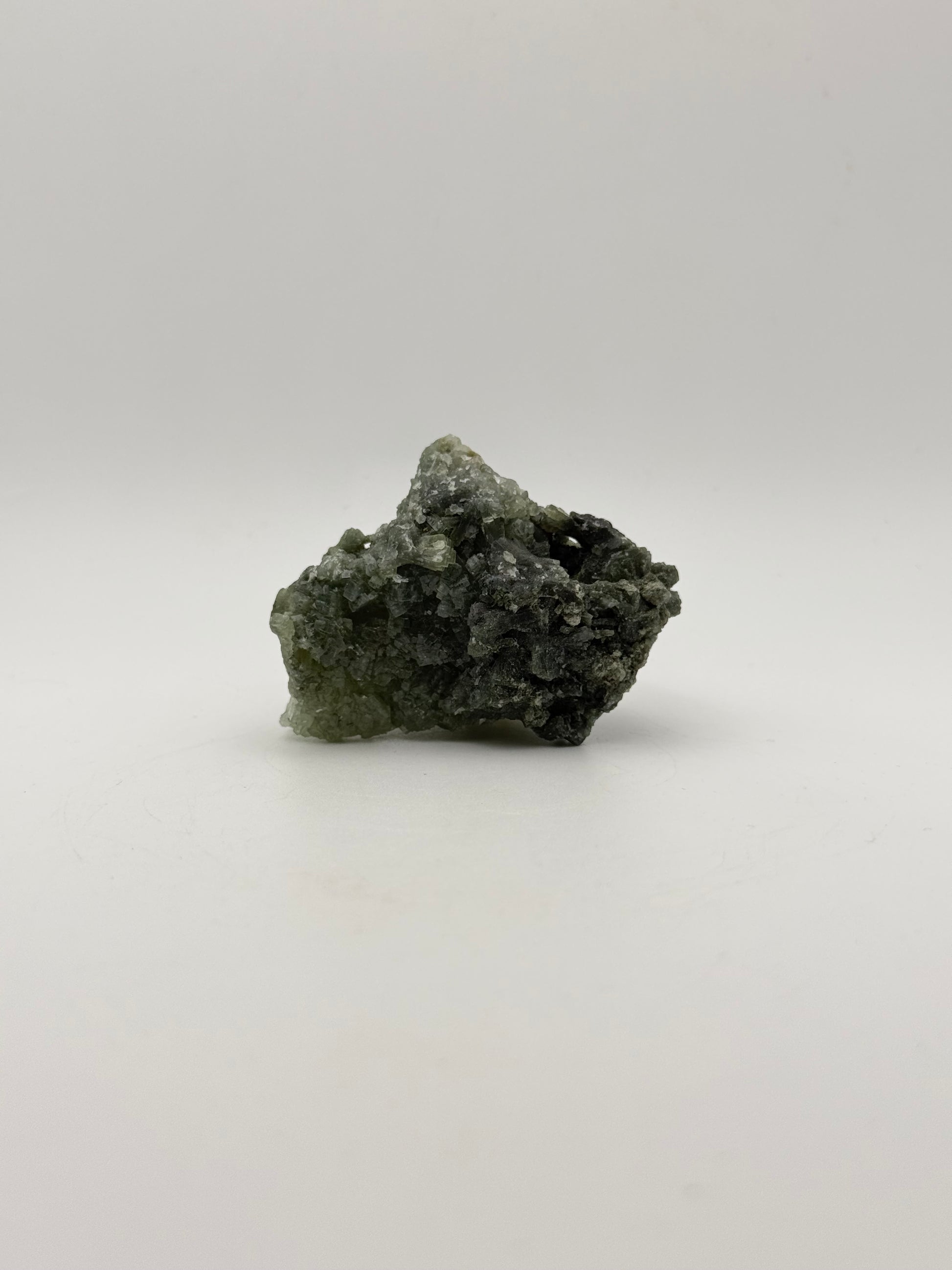 Raw prehnite specimen with good green coloring.