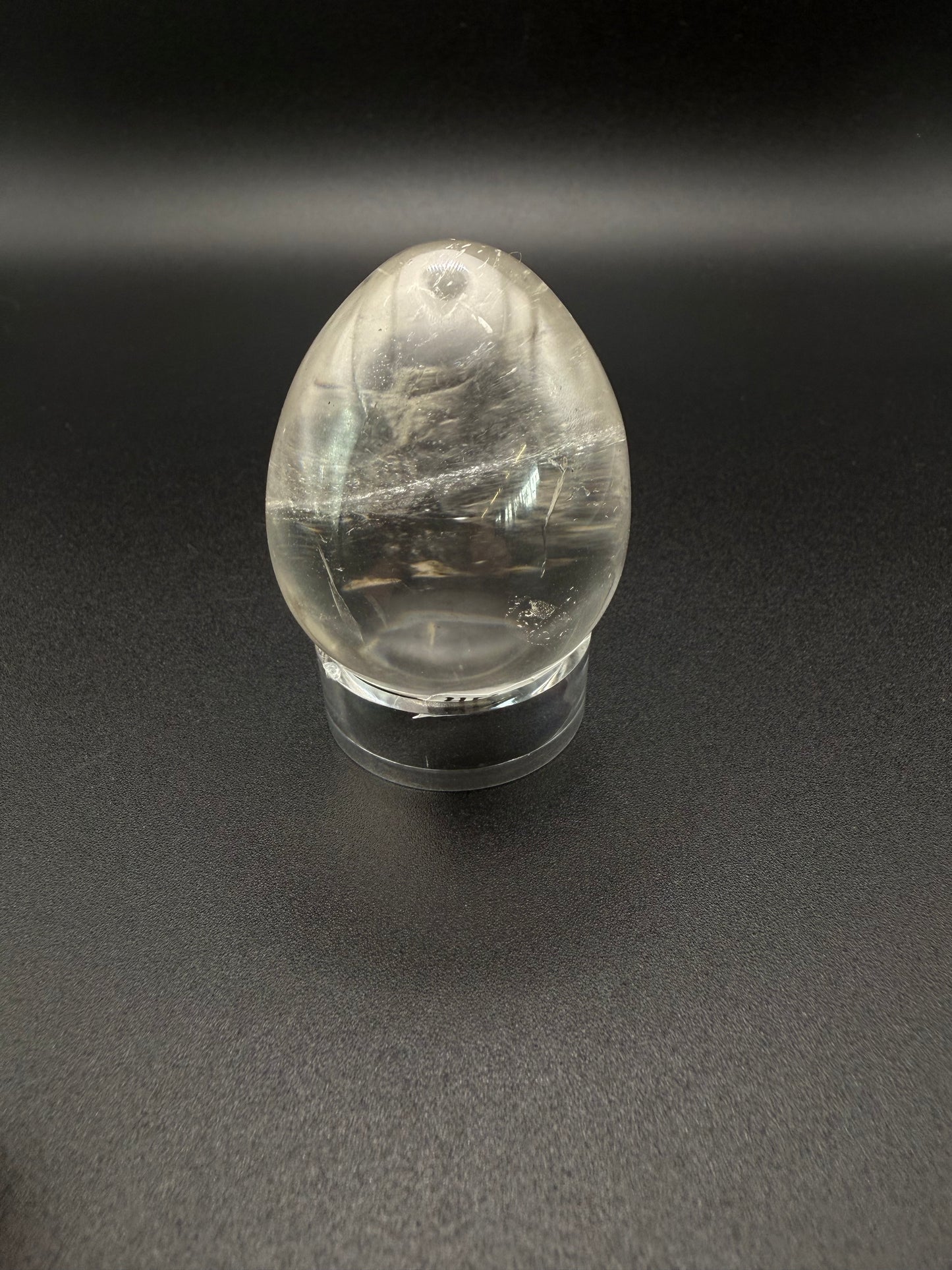 Clear quartz polished crystal in an egg shape.