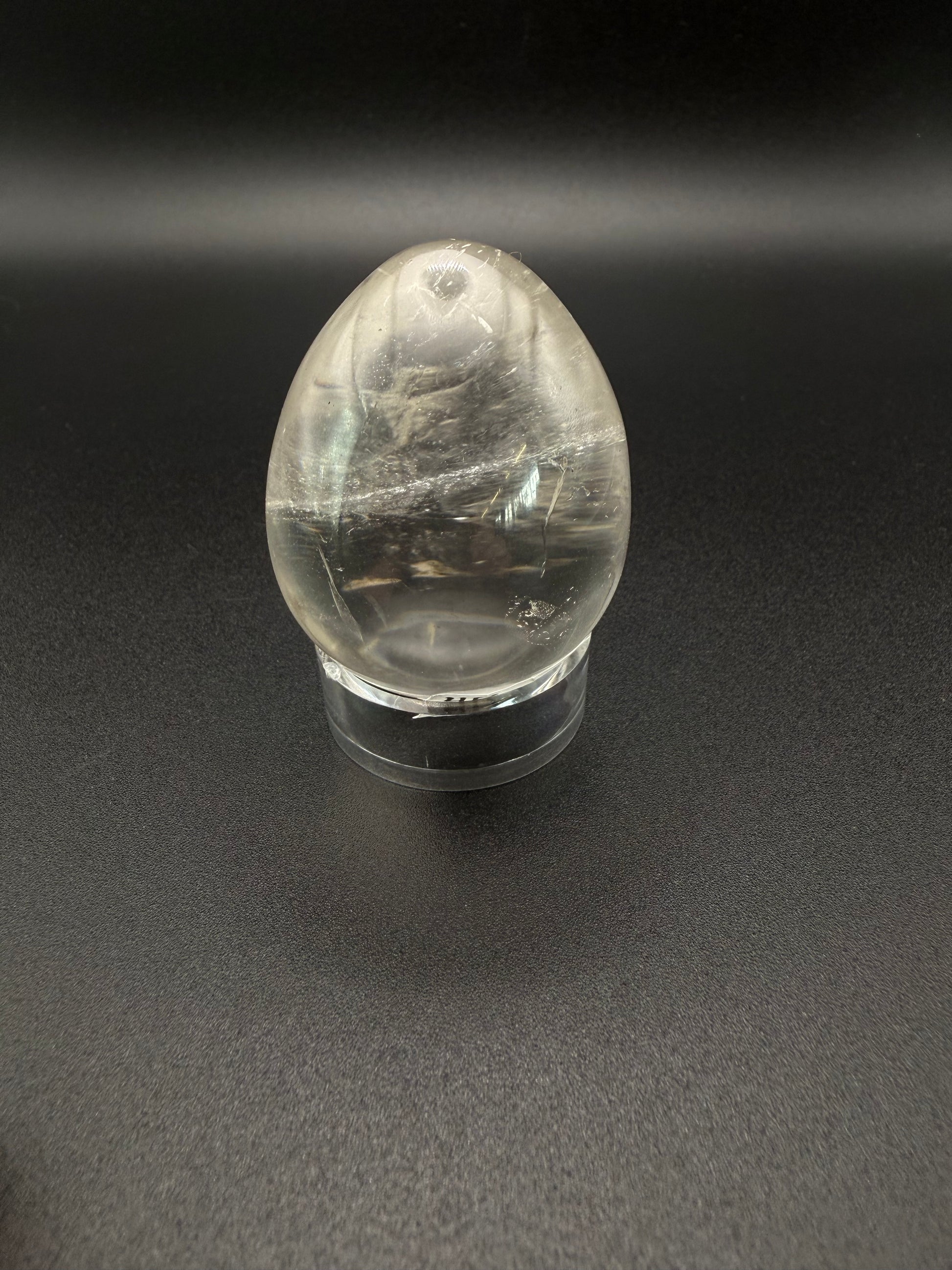 Clear quartz polished crystal in an egg shape.