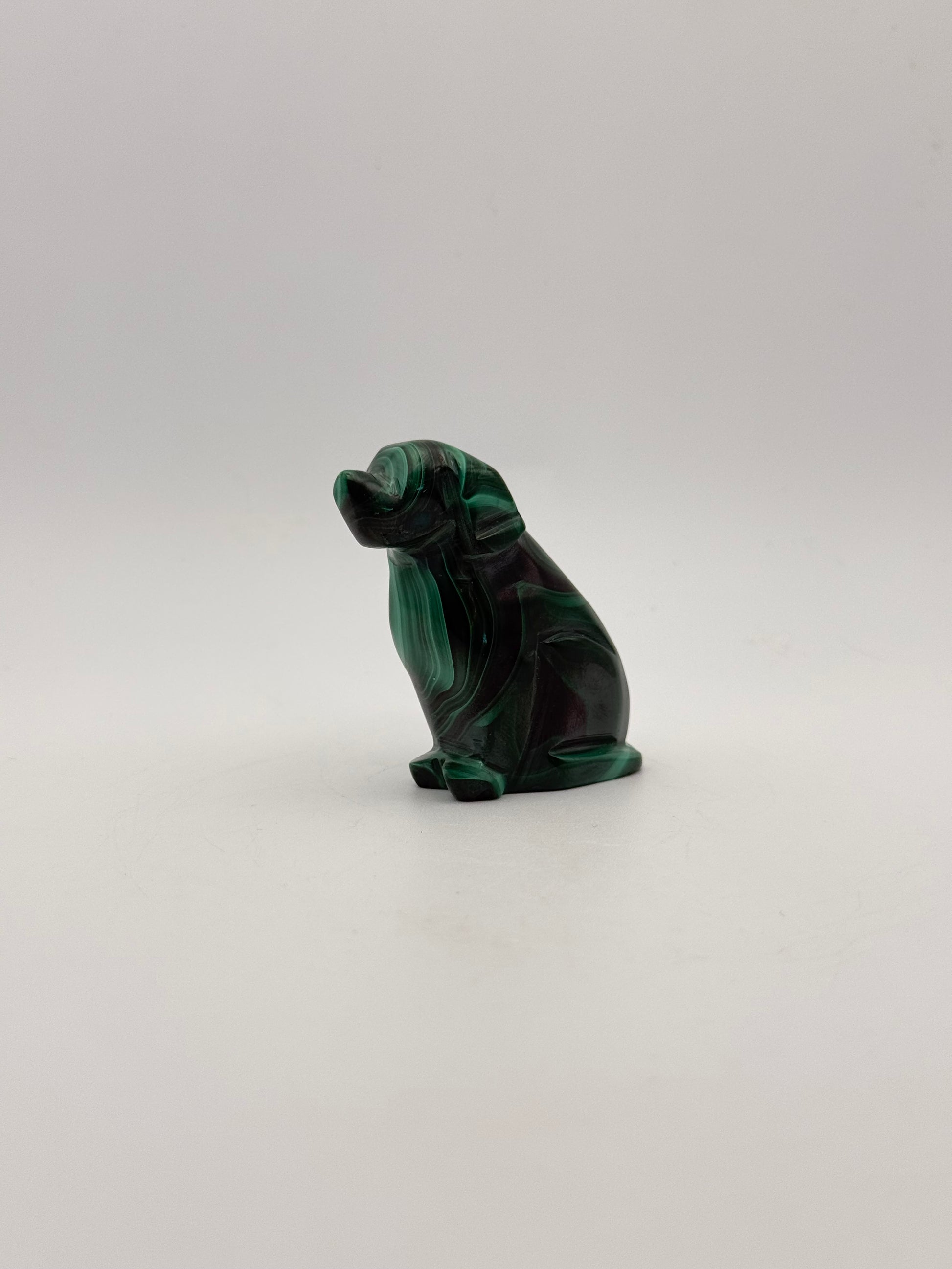 Polished malachite dog carving.