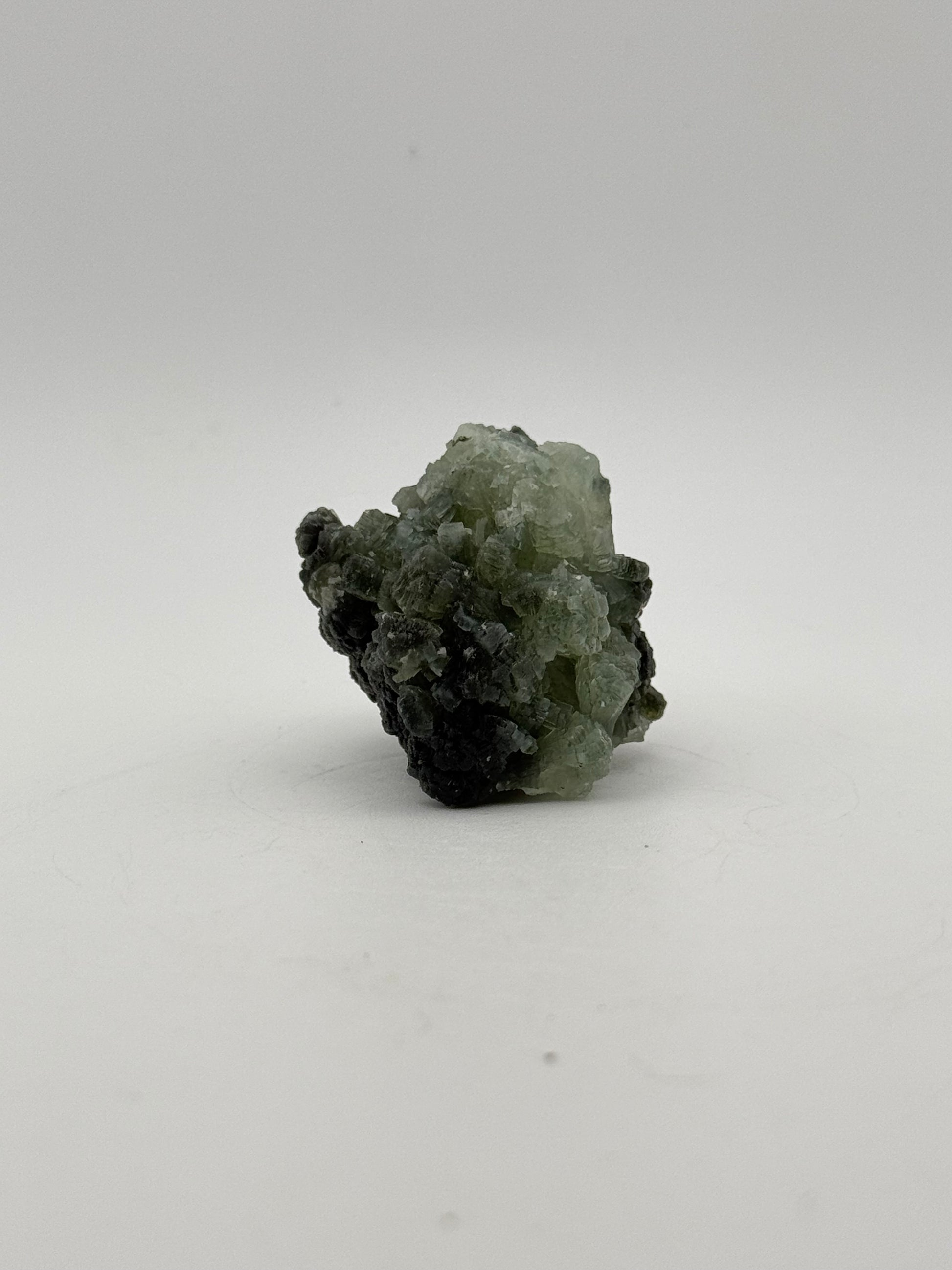 Raw Prehnite specimen with amazing green color.