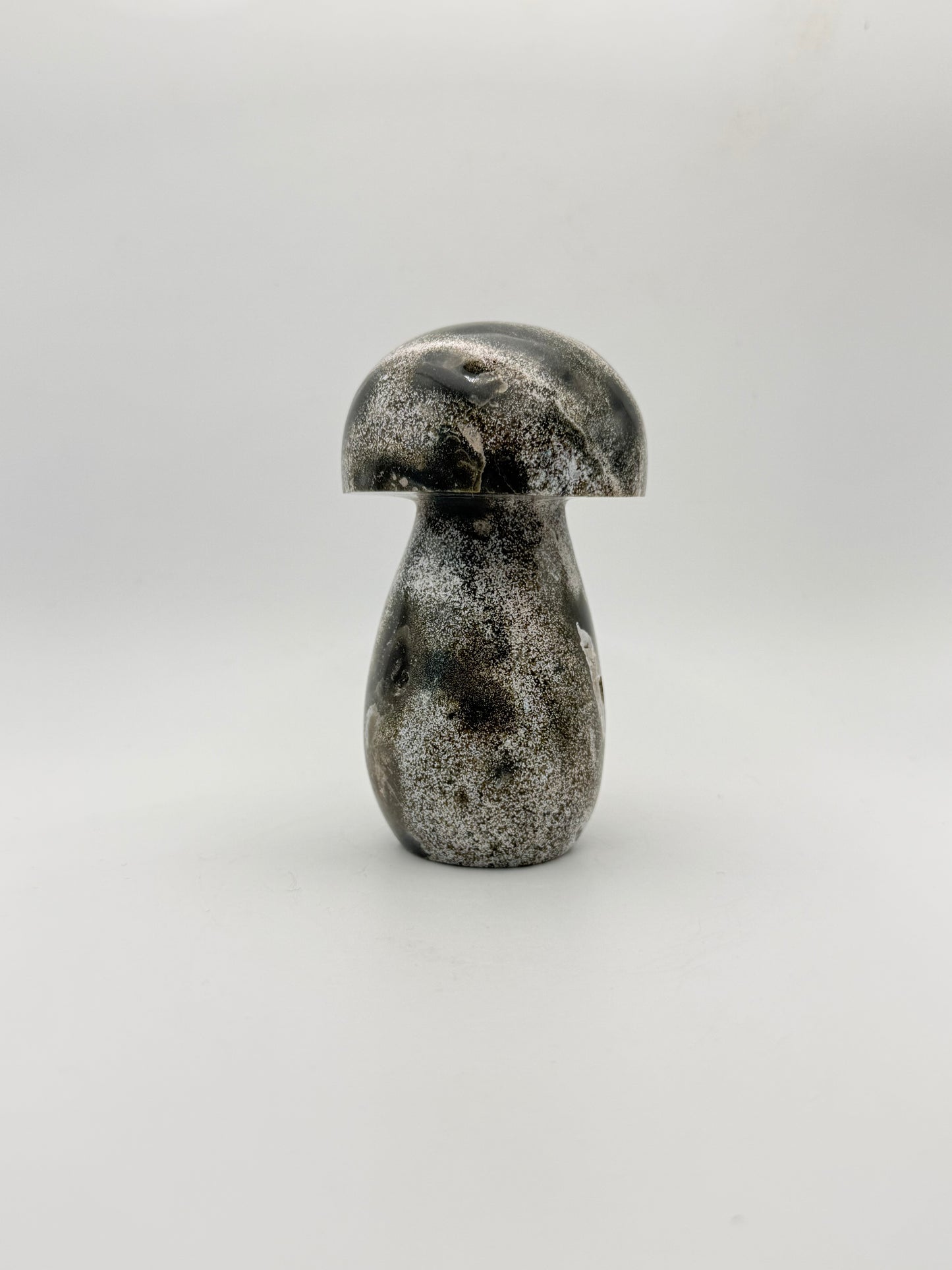 Ocean jasper stone in the shape of a mushroom.