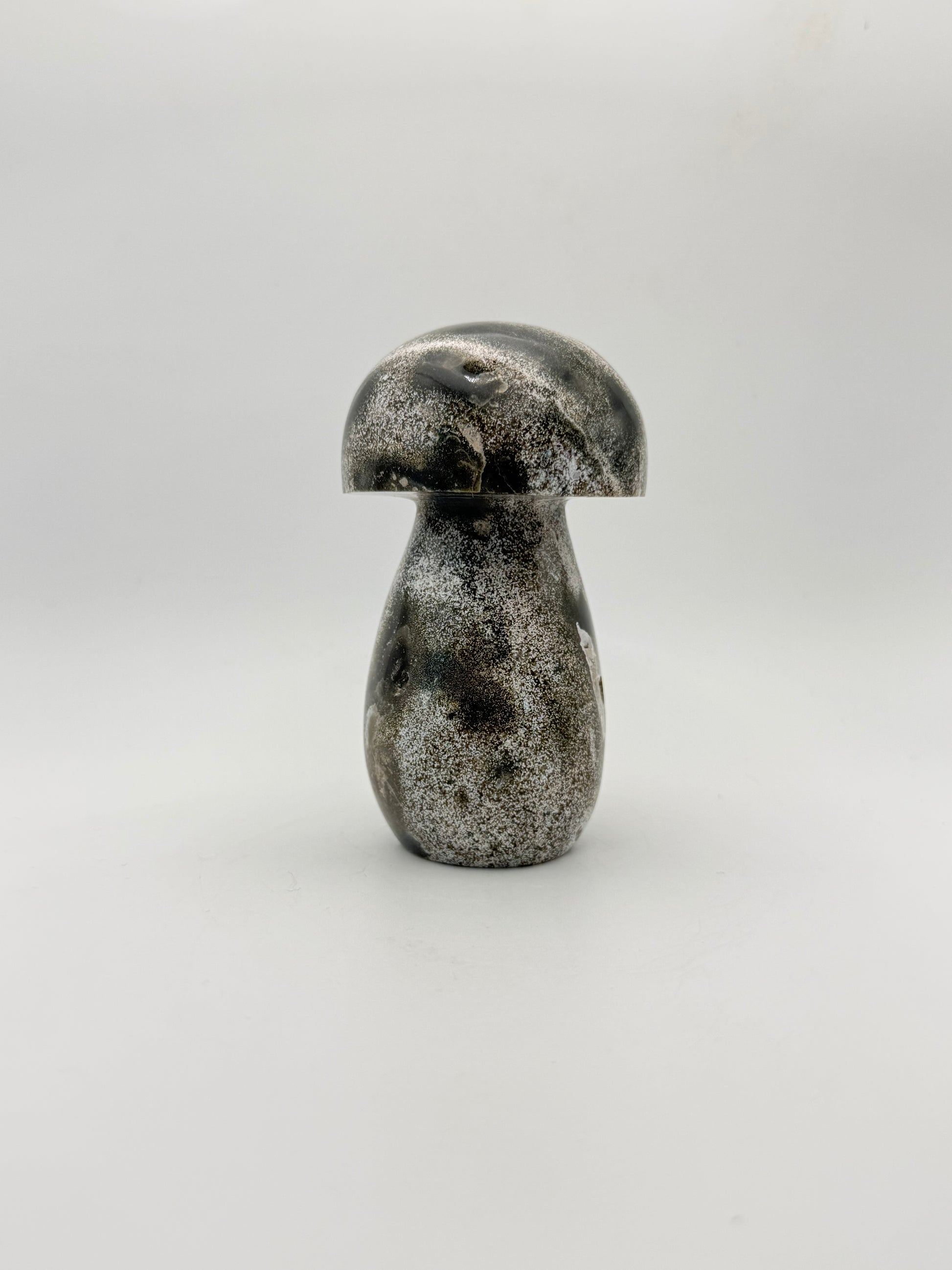 Ocean jasper stone in the shape of a mushroom.