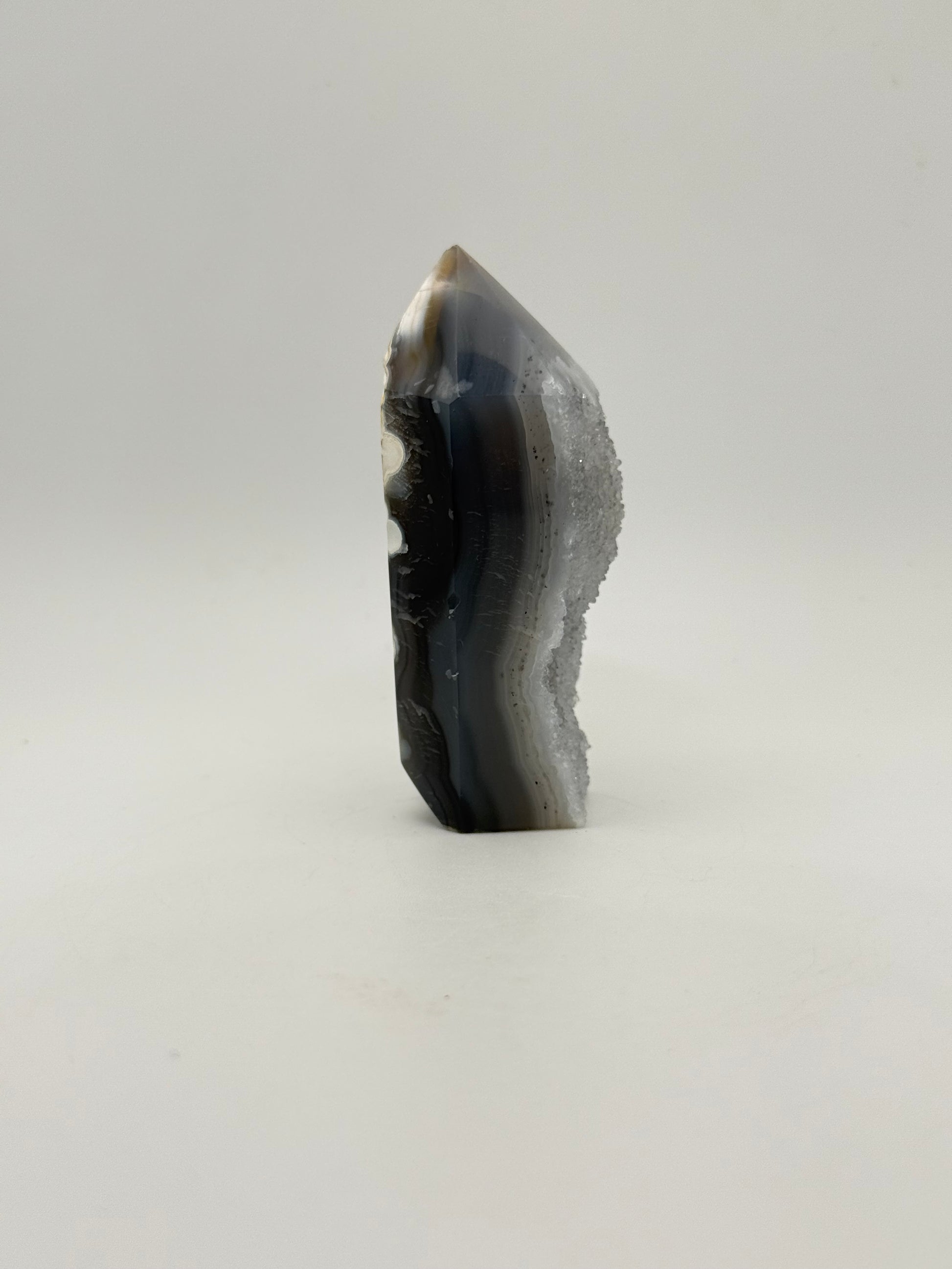 Polished druzy agate tower. About 3  inches tall.