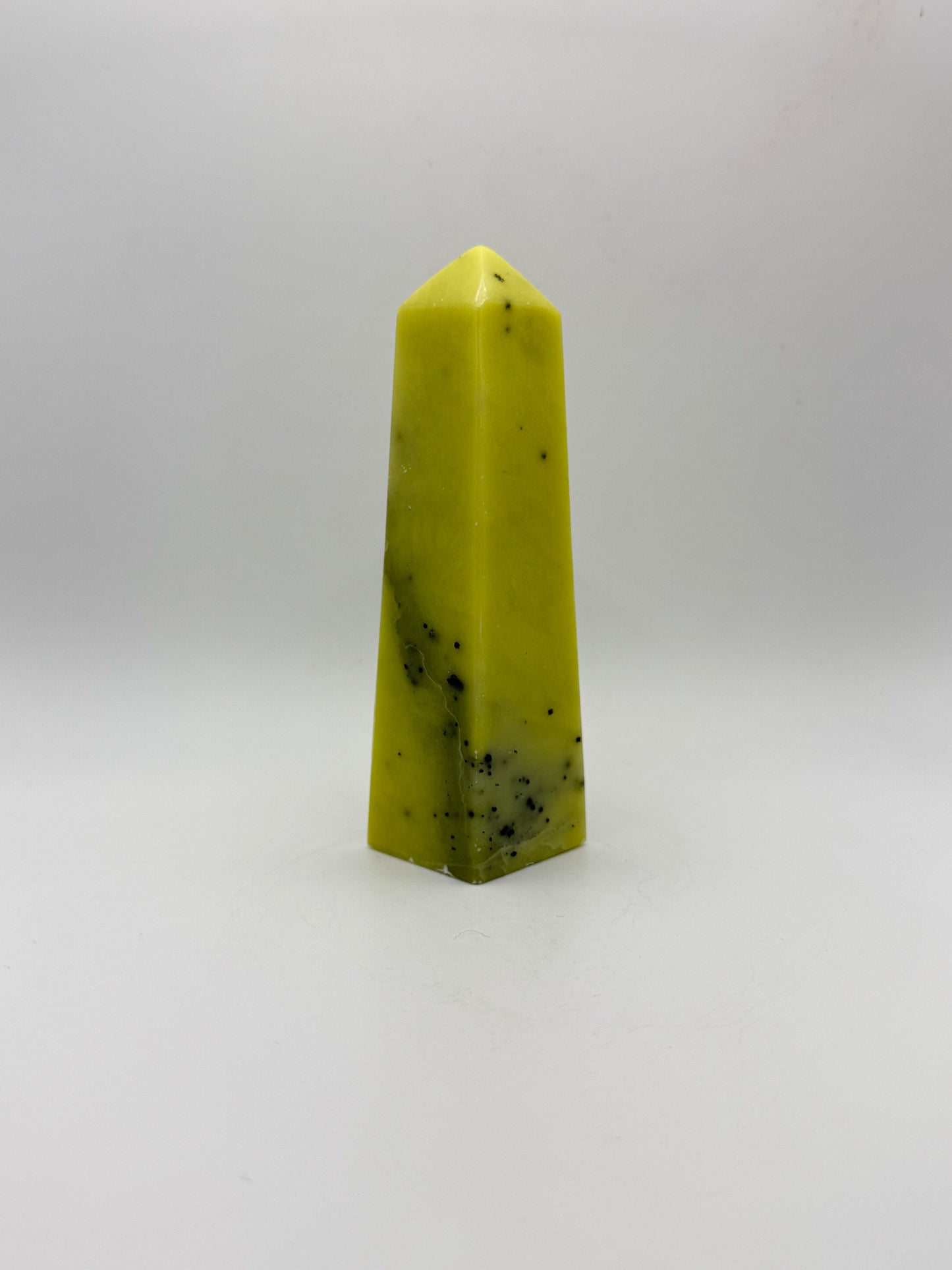 Polished healerite four sided tower.