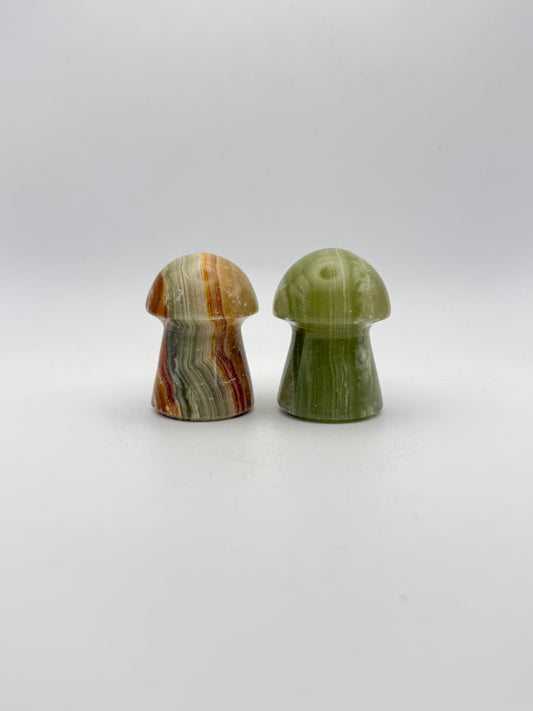 Two onyx mushroom-shaped stones.