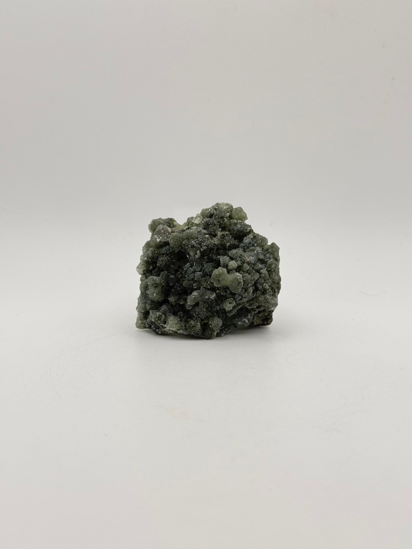 Raw Prehnite specimen with amazing green color.