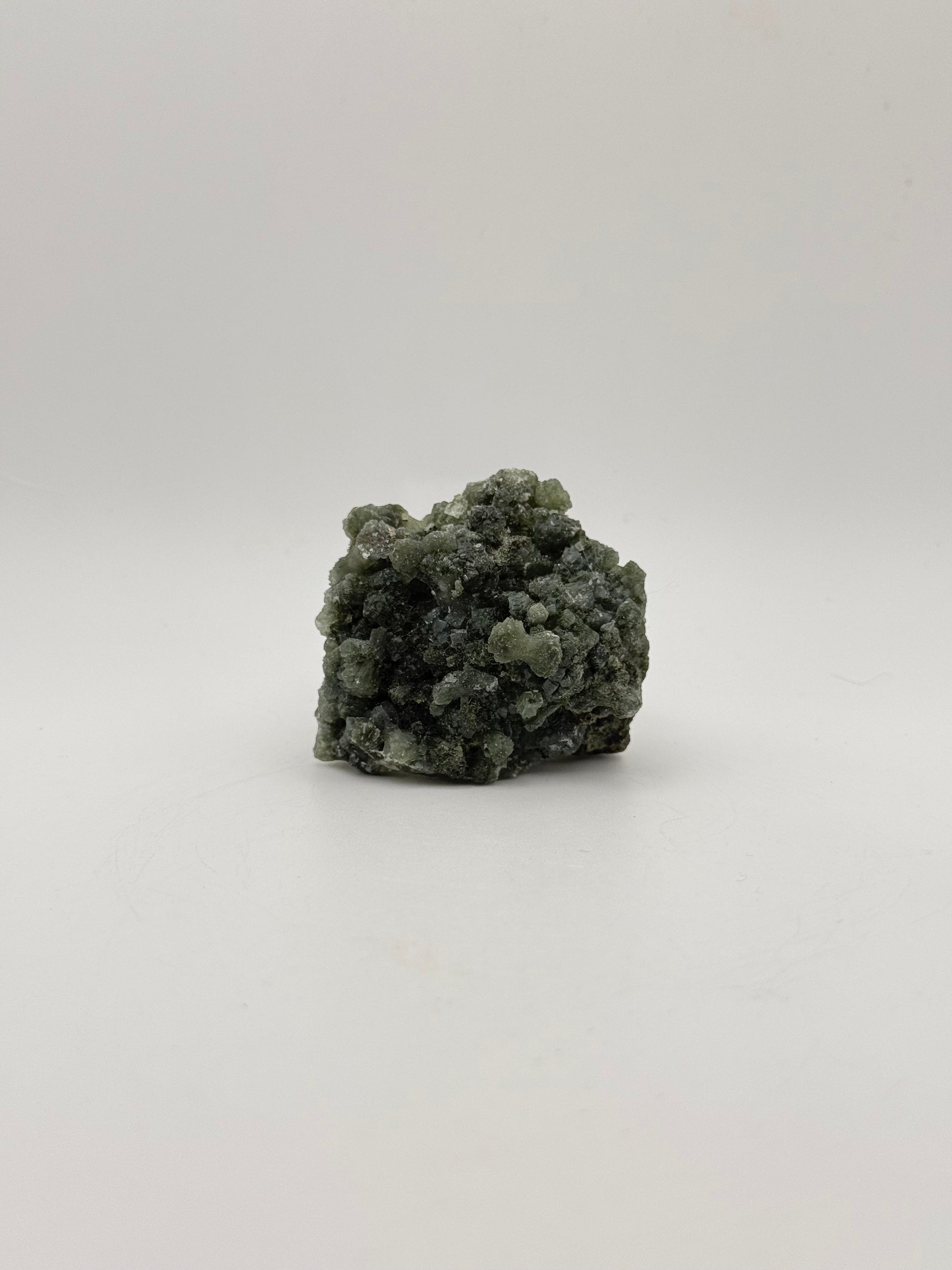 Raw Prehnite specimen with amazing green color.