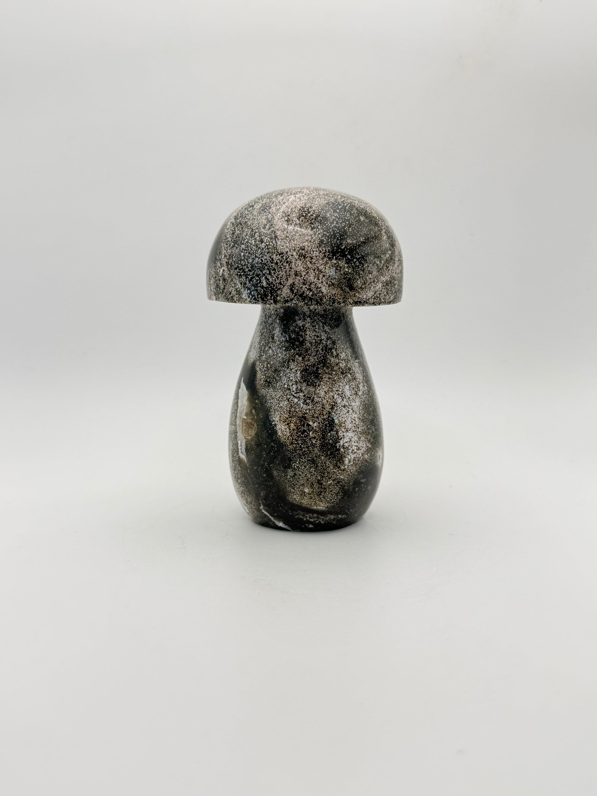 Ocean jasper stone in the shape of a mushroom.