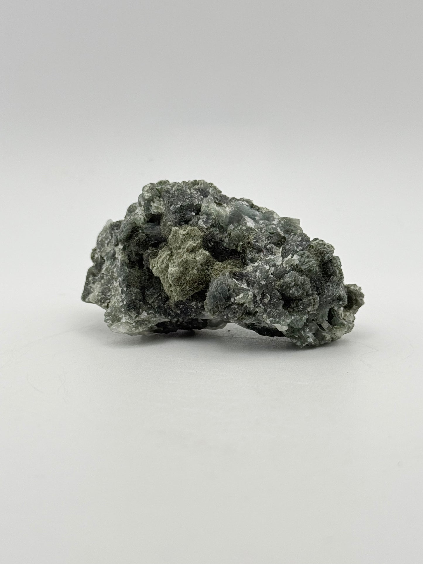 Raw prehnite specimen with amazing green color.