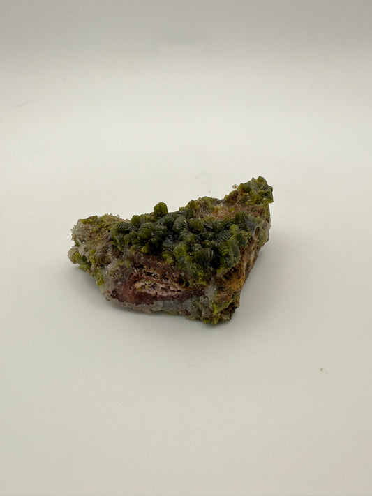 Epidote crystal cluster with good green color.