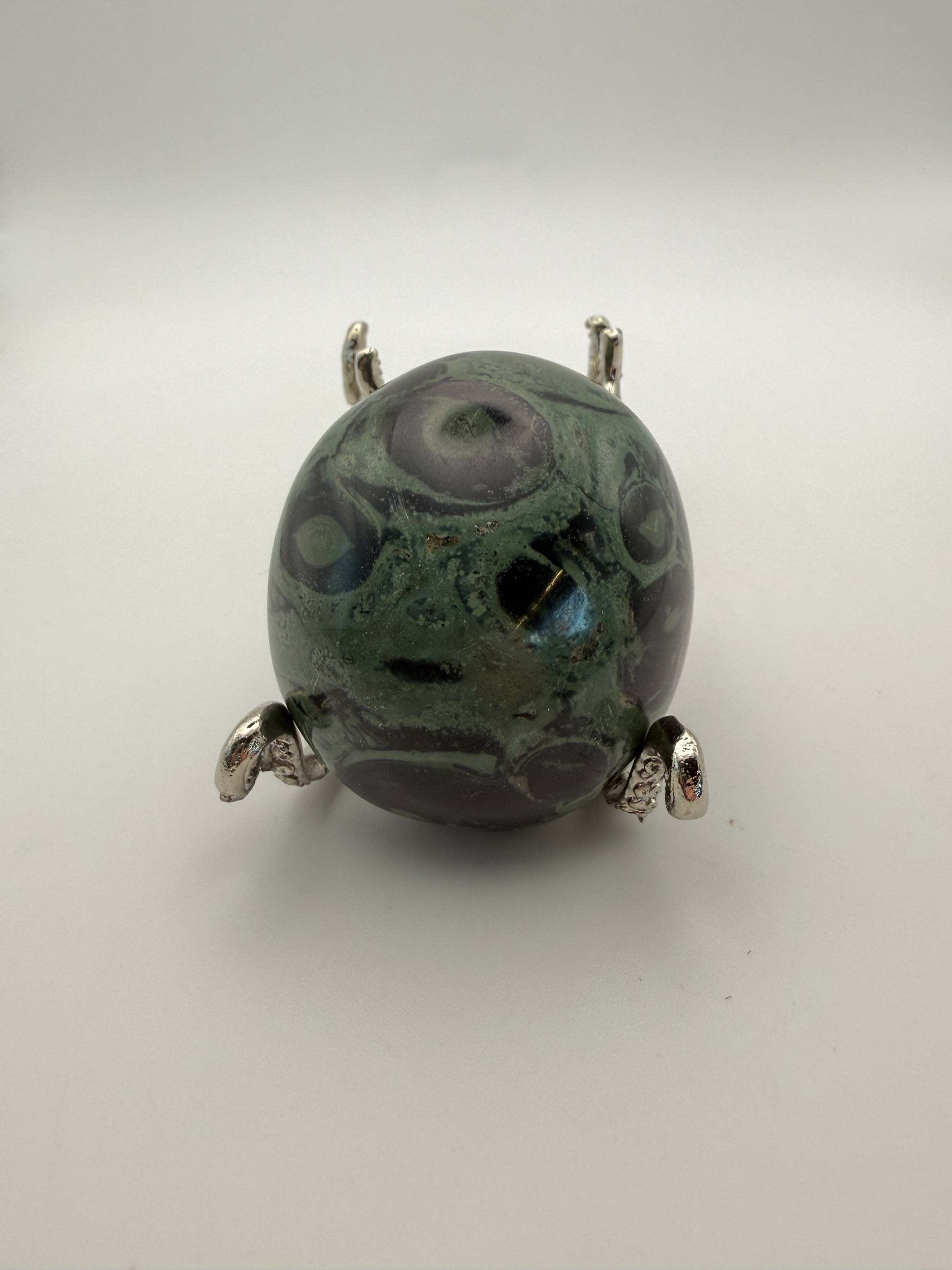 Polished kambaba jasper palm stone.